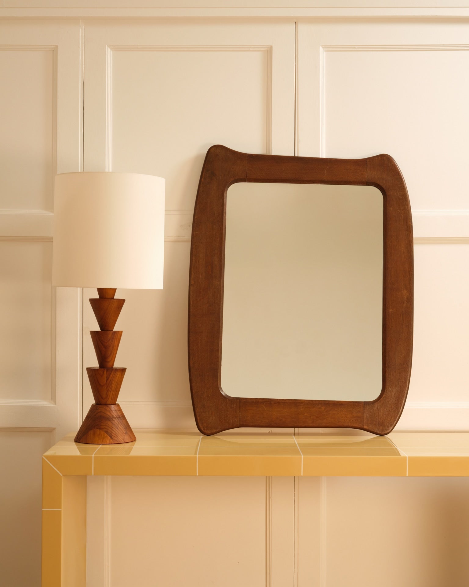 Wooden organic mirror — styled on yellow tiled console with lamp