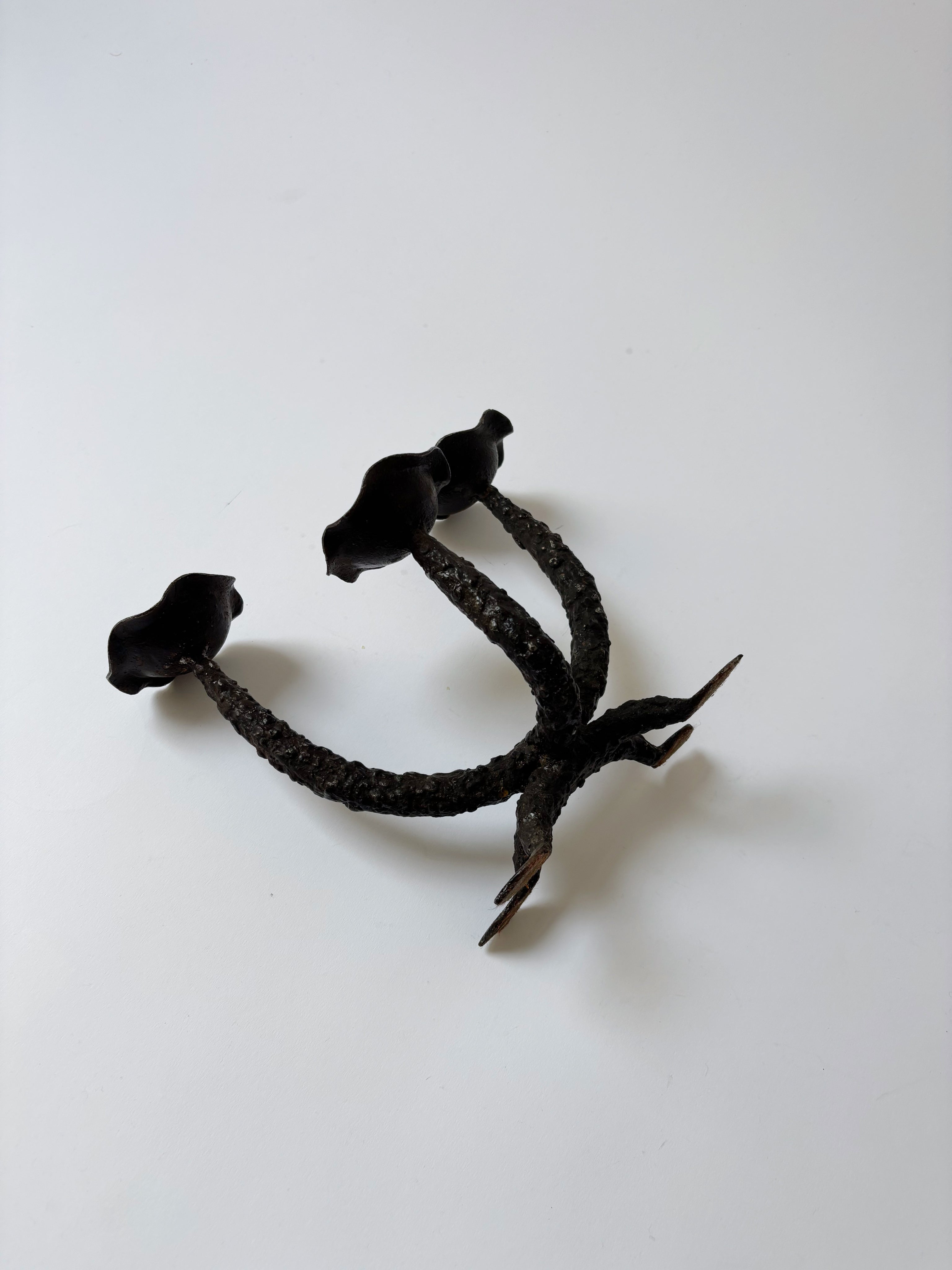 Metal Textured Artisan Candlestick, Poland — overhead view on white surface