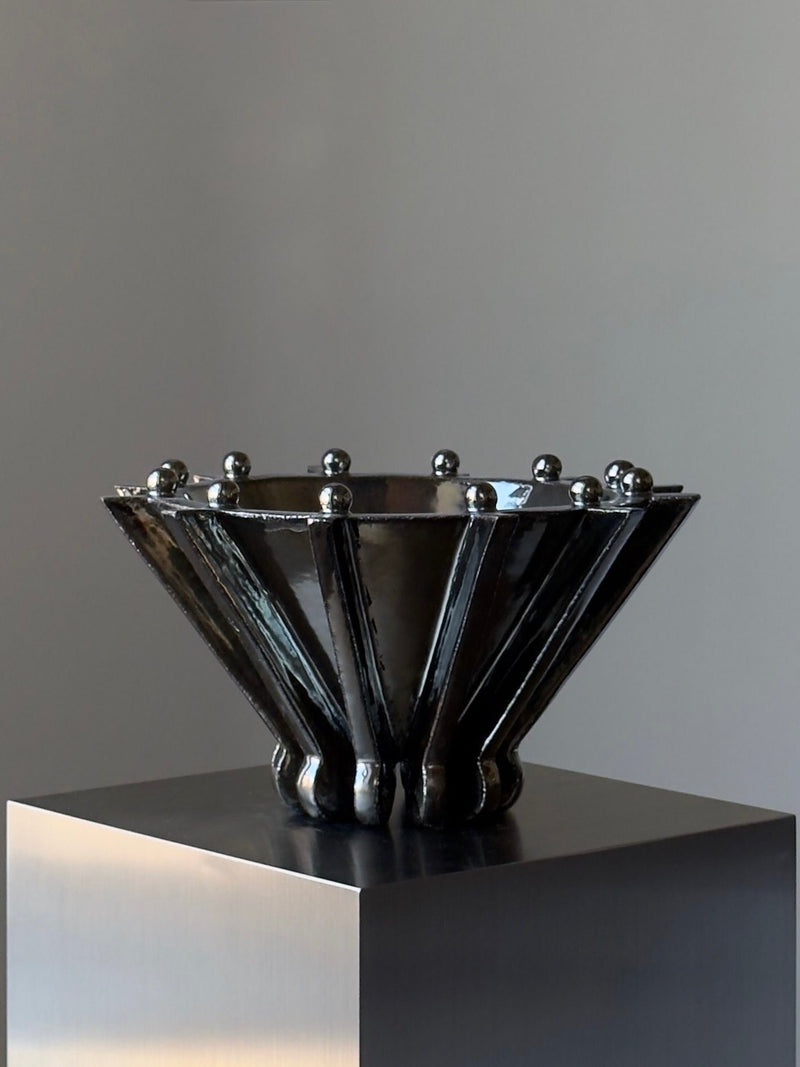 Contemporary black ceramic vase with metallic spheres by Devin Wilde