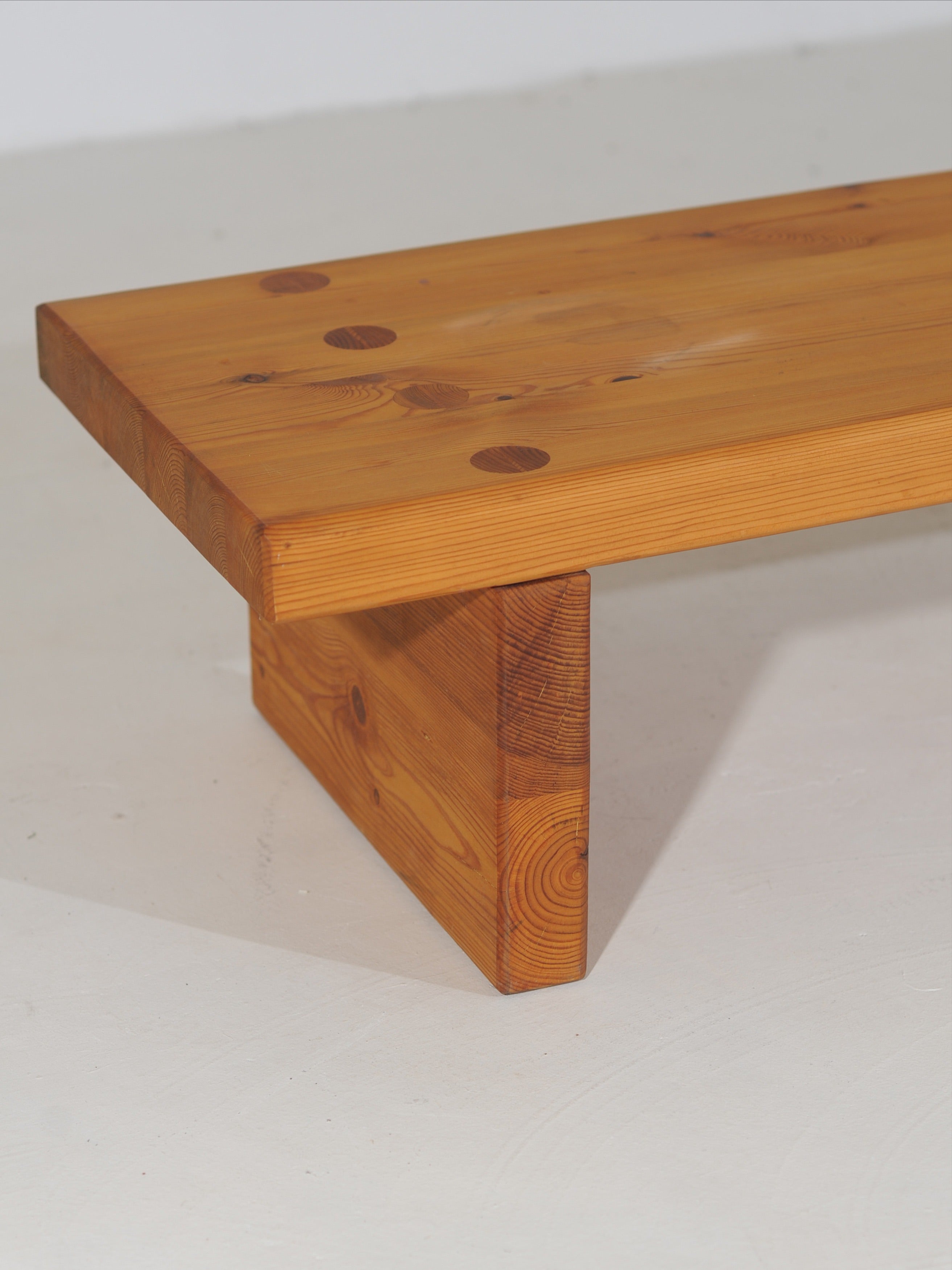 Pine bench construction detail showing thick wood beam support structure