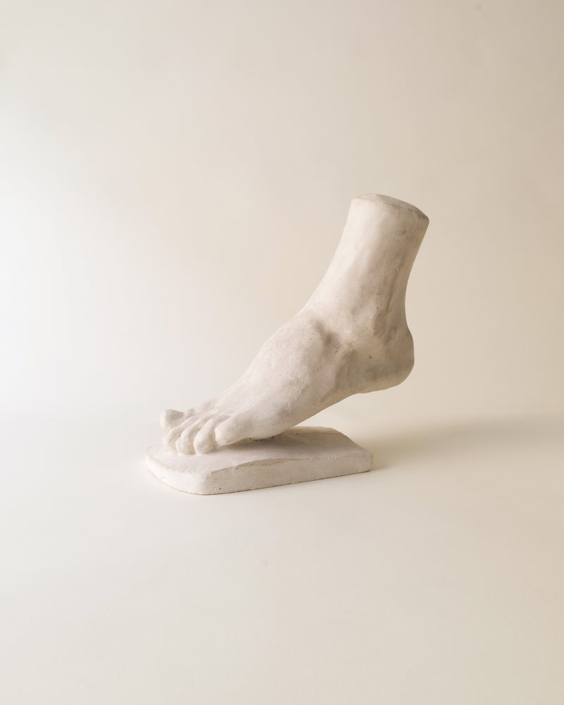 White marble anatomical foot sculpture on base, classical study