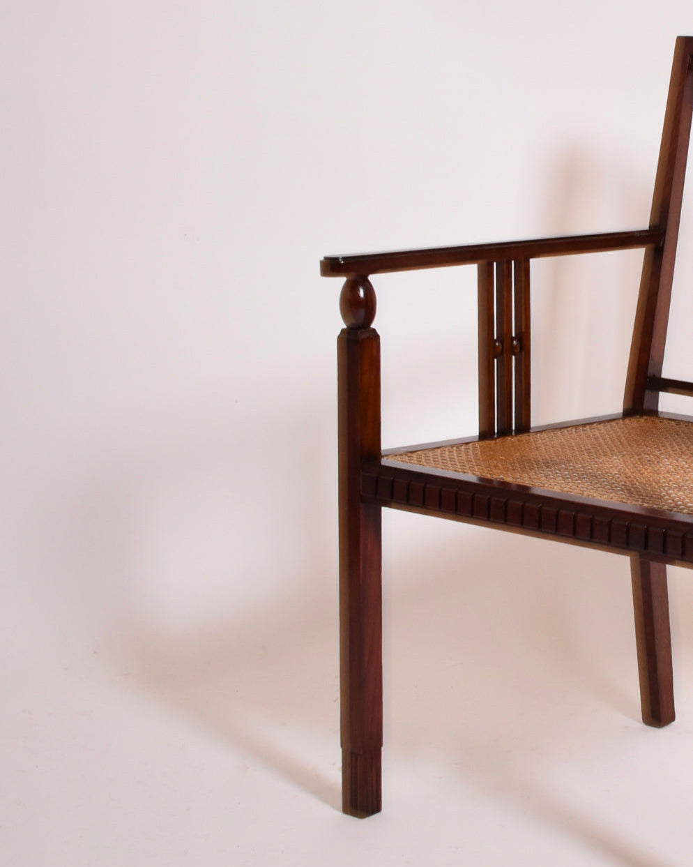 The Barracuda Interiors Viennese Secession Armchair, 1910s, features a woven cane seat and backrest, angular armrests, and straight legs, capturing vintage elegance against a plain white background.