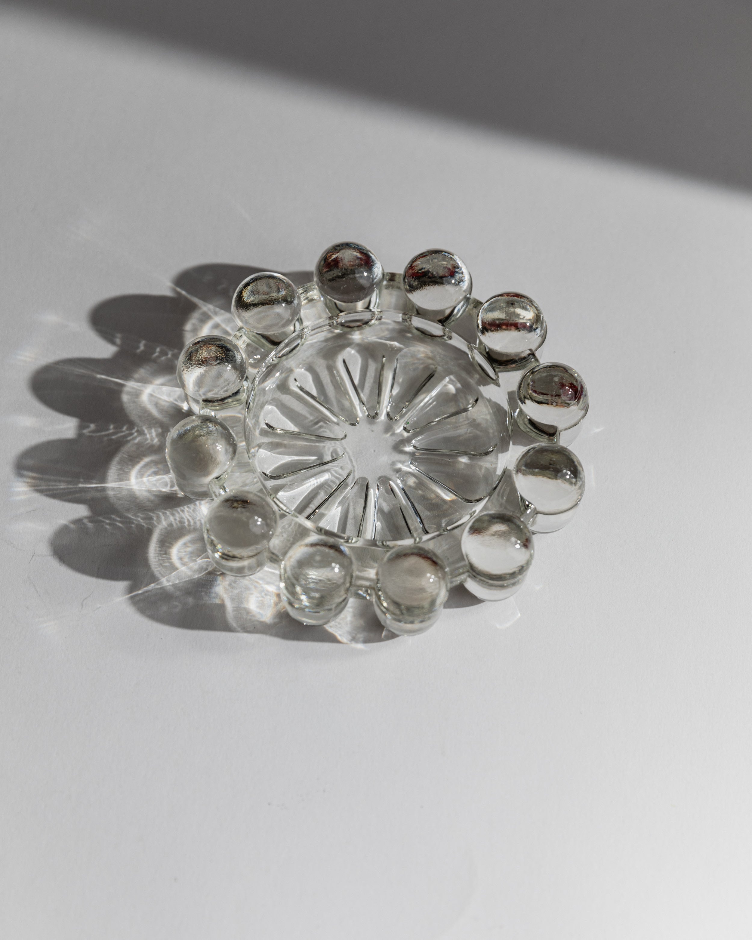 Clear glass ashtray with decorative spherical details, 1970s Italian design