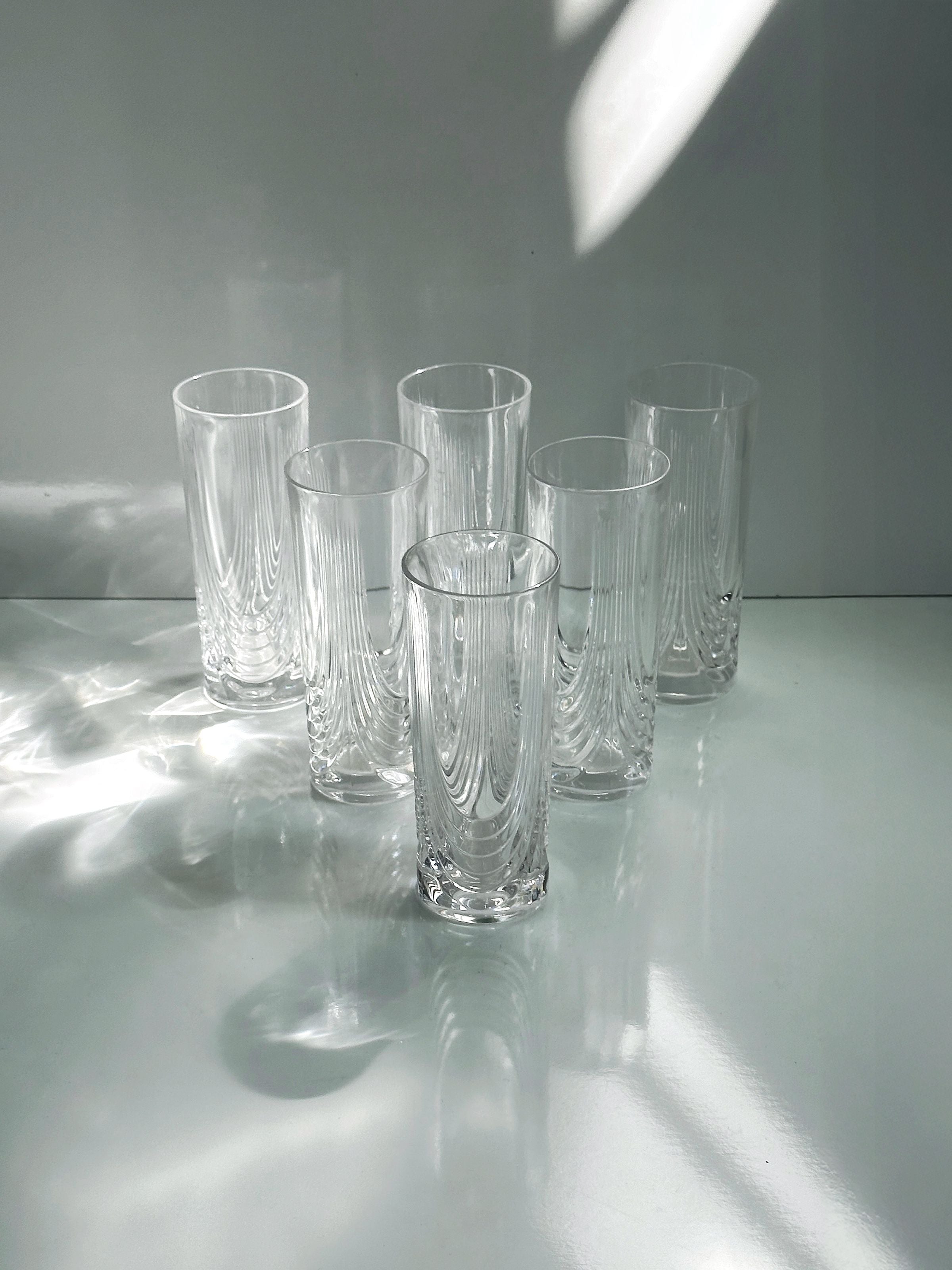 2 Italian Art Deco Crystal Glass Sets of 8 and 6 — close-up of clear glass texture on white surface