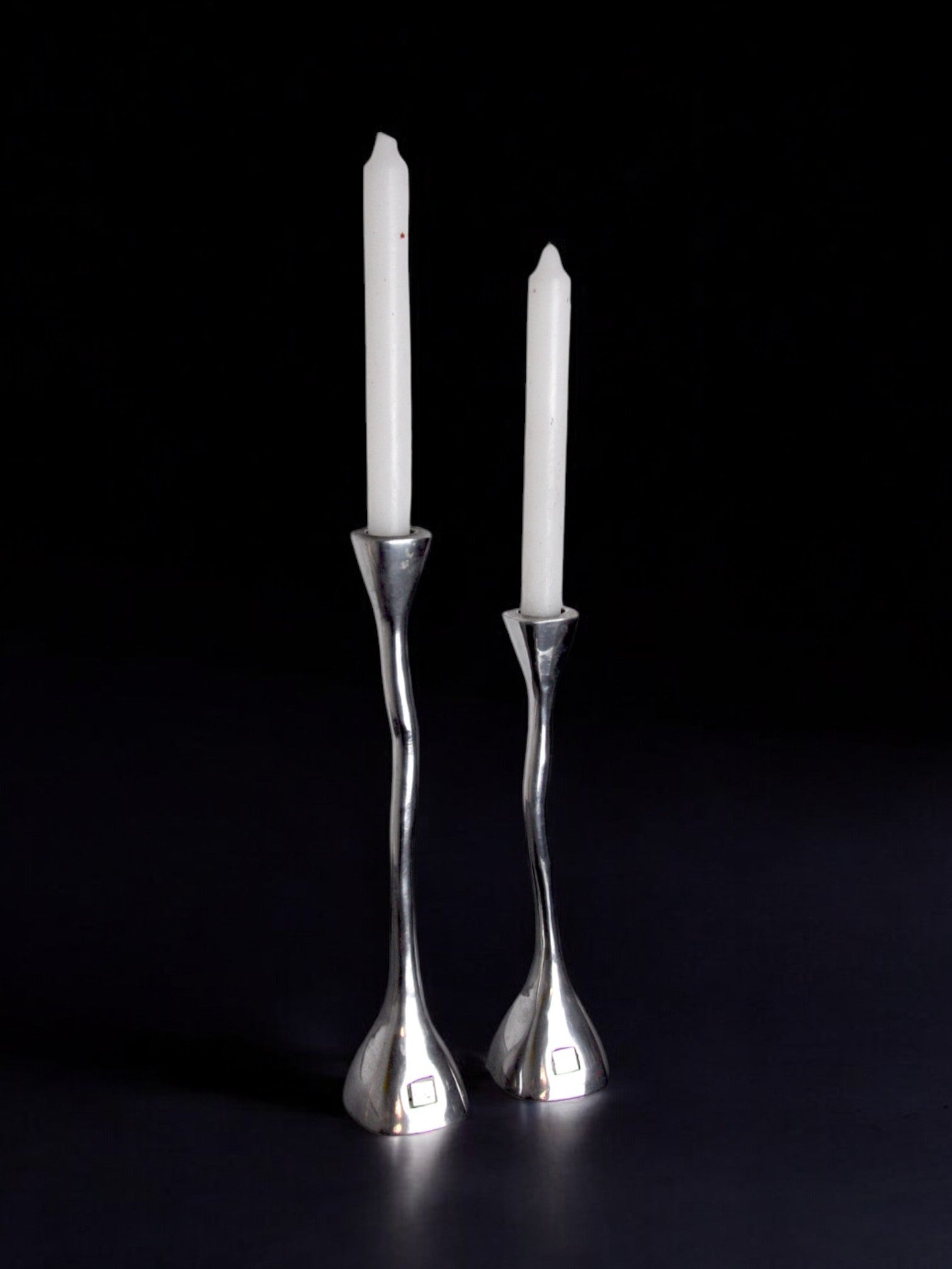 Pair of Candleholders, art3, Spain, 1970s — close-up of polished silver finish