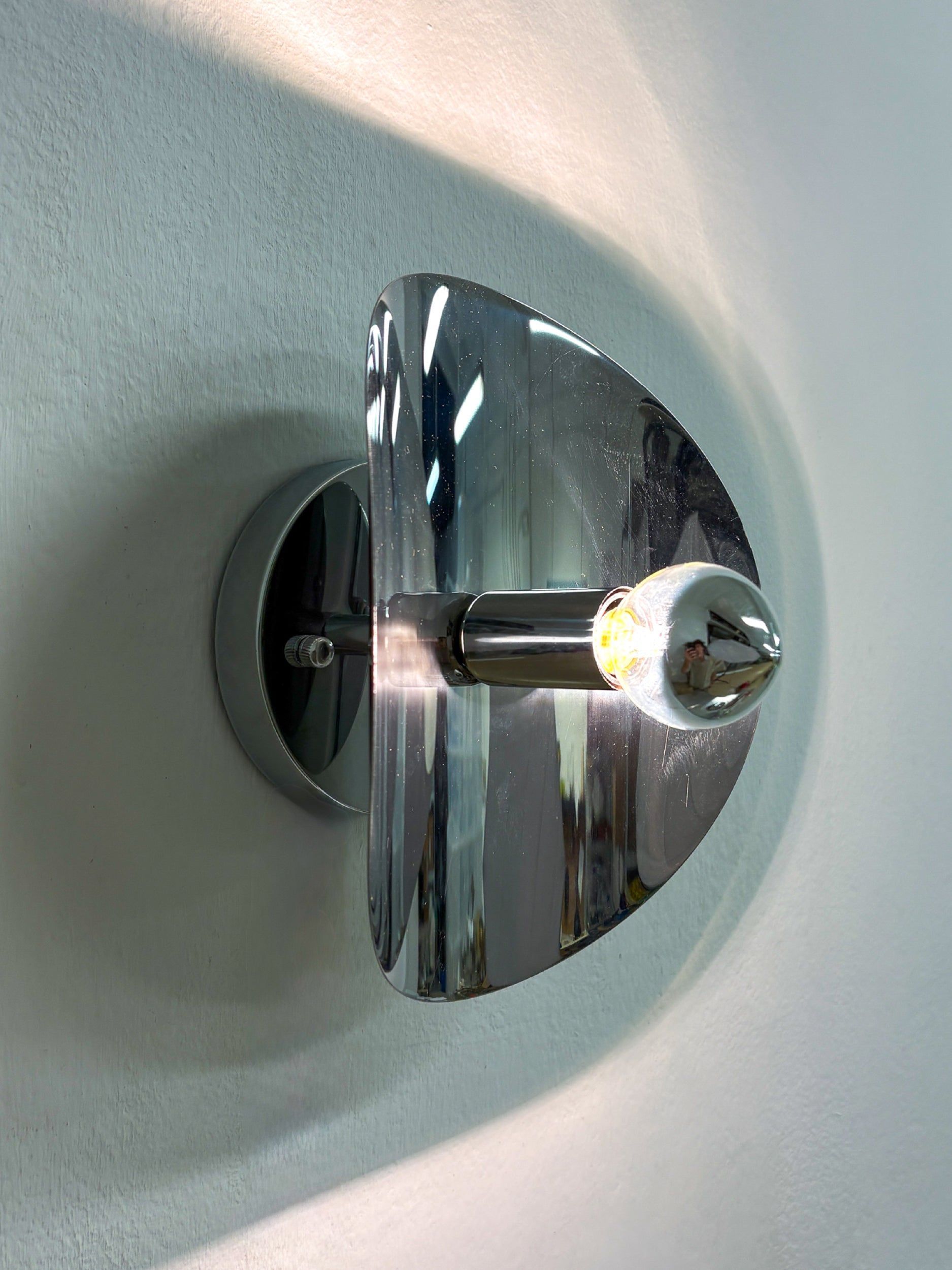 Folio Sconce, Chromed Metal, Italy, 1970s — angled view on white wall