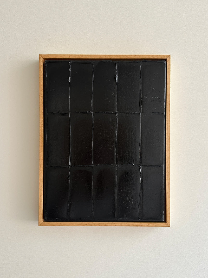 Abstract black paint grid artwork in natural wood frame by Roi Elmaliah
