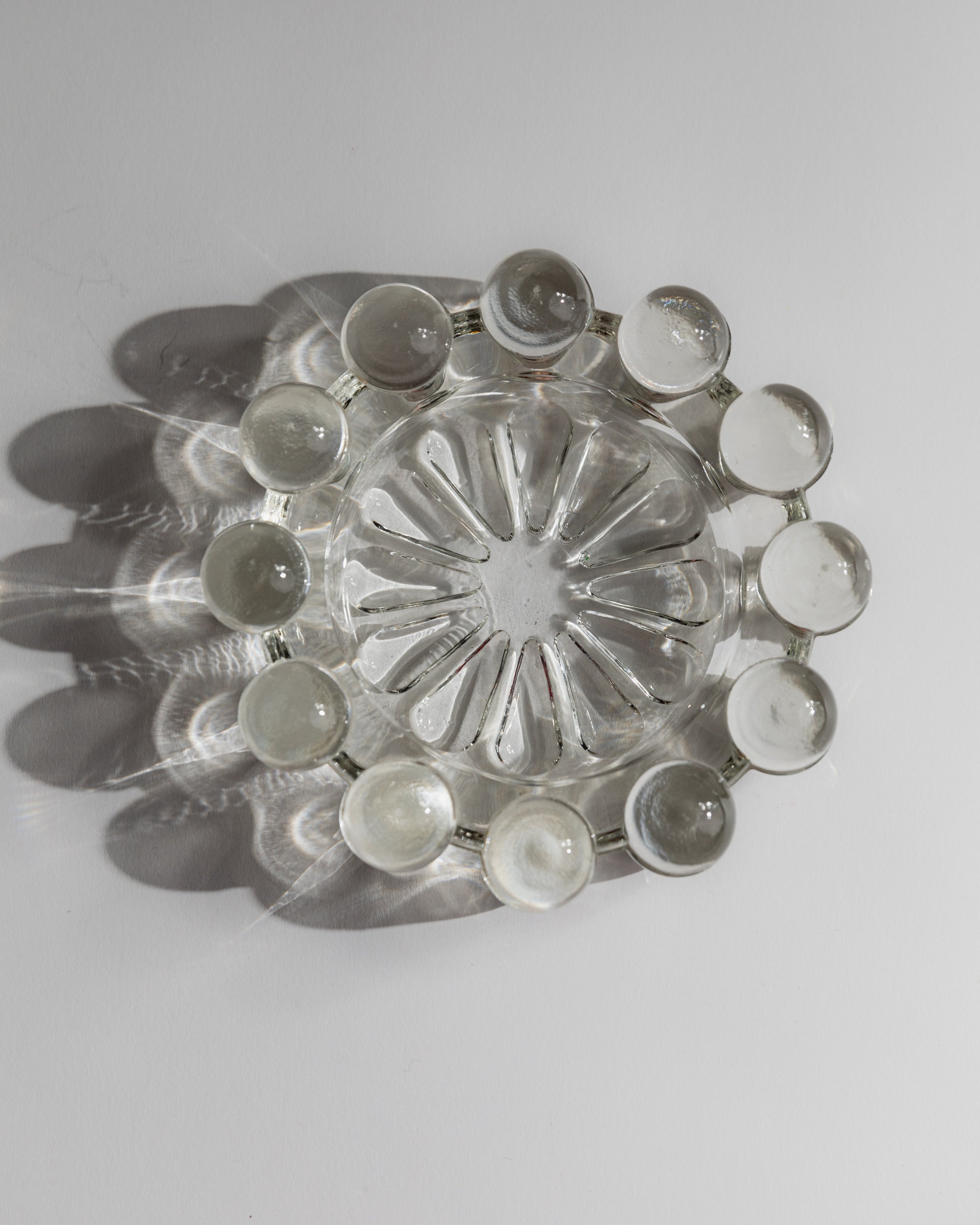 Top view of 1970s Italian art glass ashtray with circular design