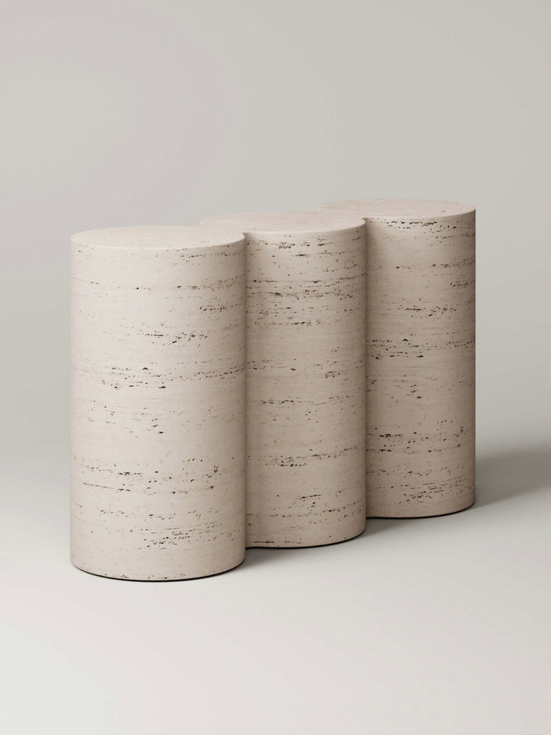 Three cylindrical travertine vases with natural stone texture