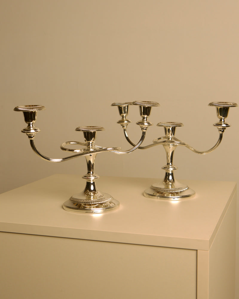 Pair of Italian metal "Medusa" candlesticks, 1980s by Treaptyque | The Oblist — polished silver finish