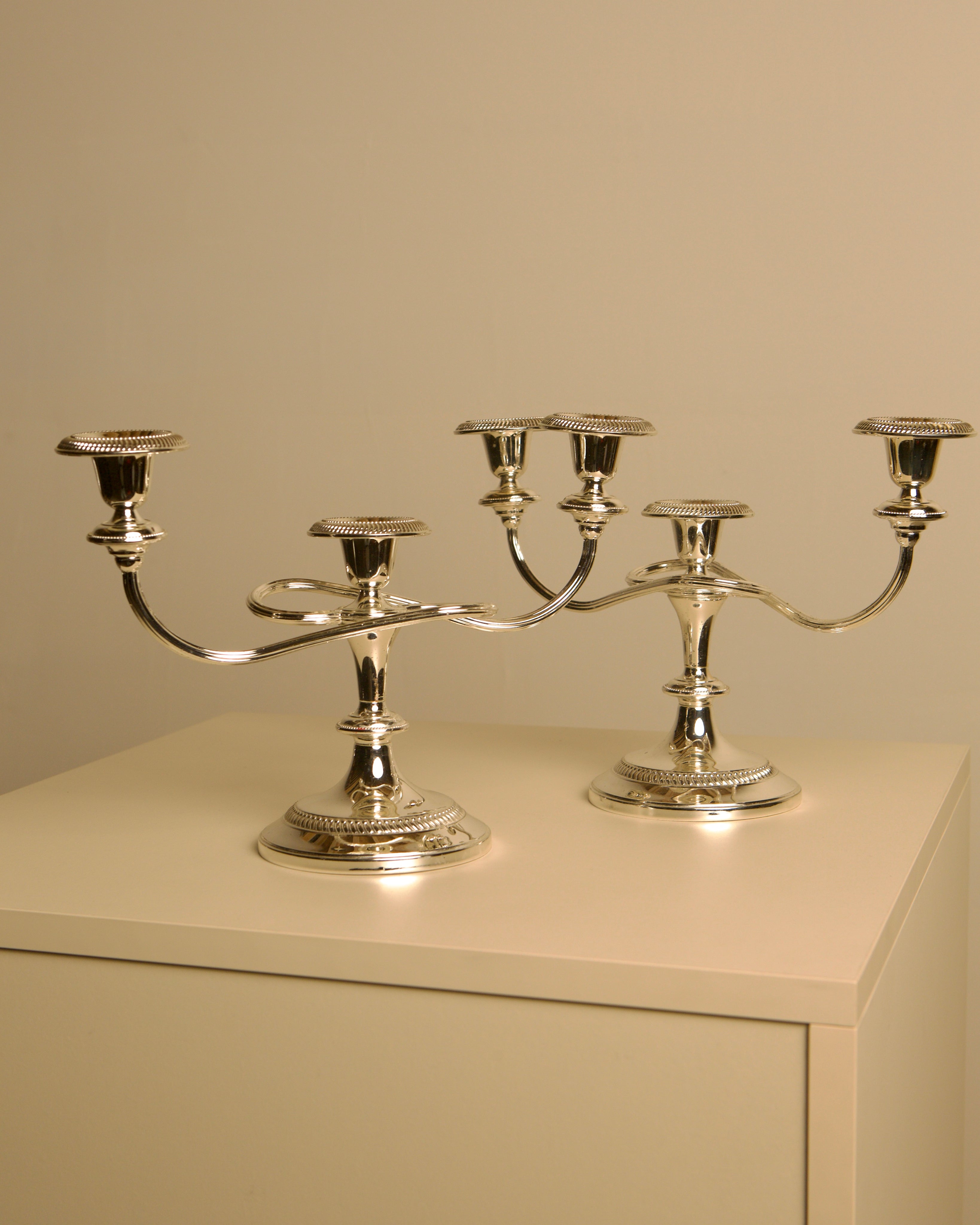 Pair of Italian metal "Medusa" candlesticks, 1980s by Treaptyque | The Oblist — polished silver finish