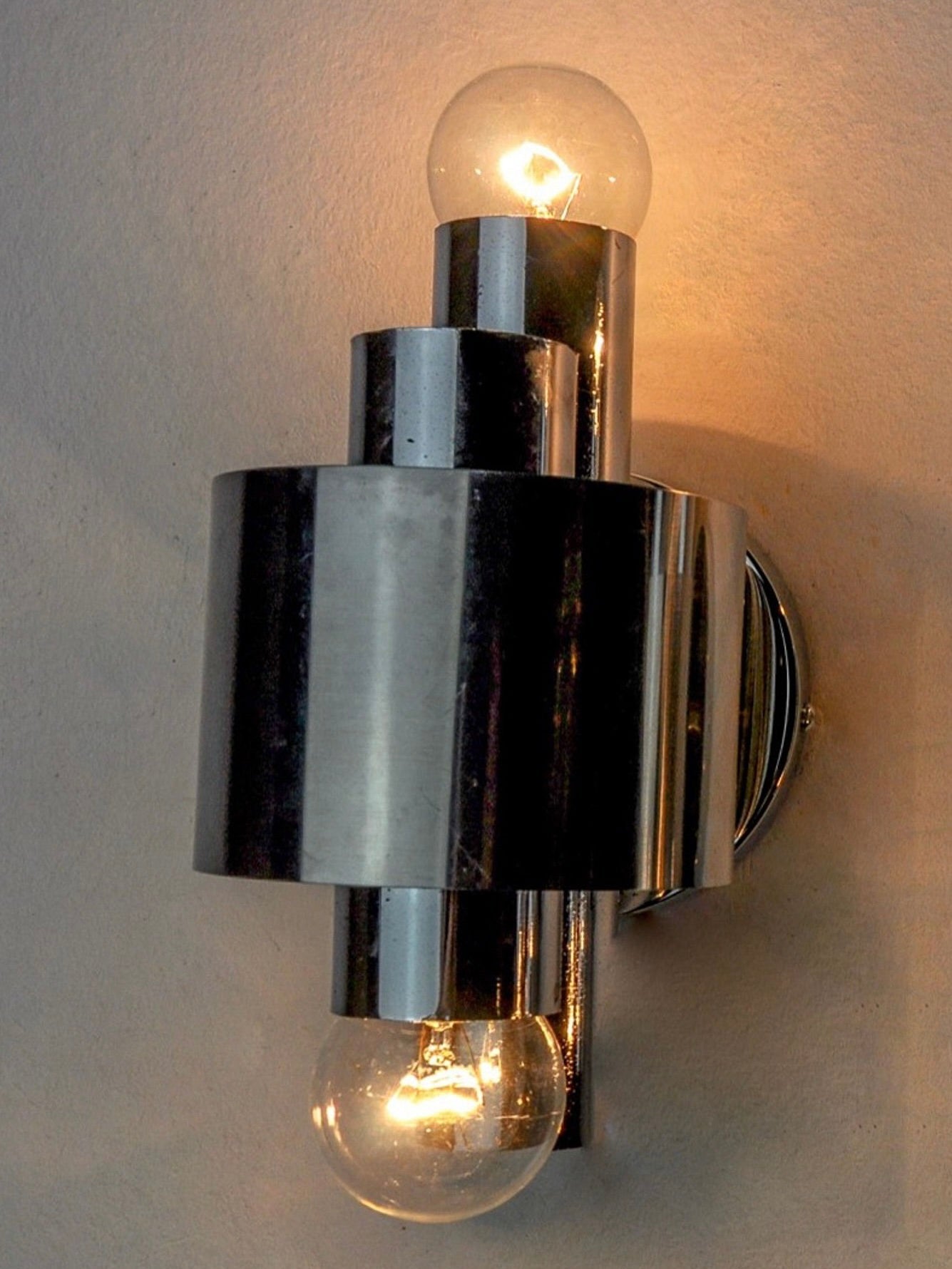 Geometric Chromed Sconce, Italy, 1970 — angled view on textured wall