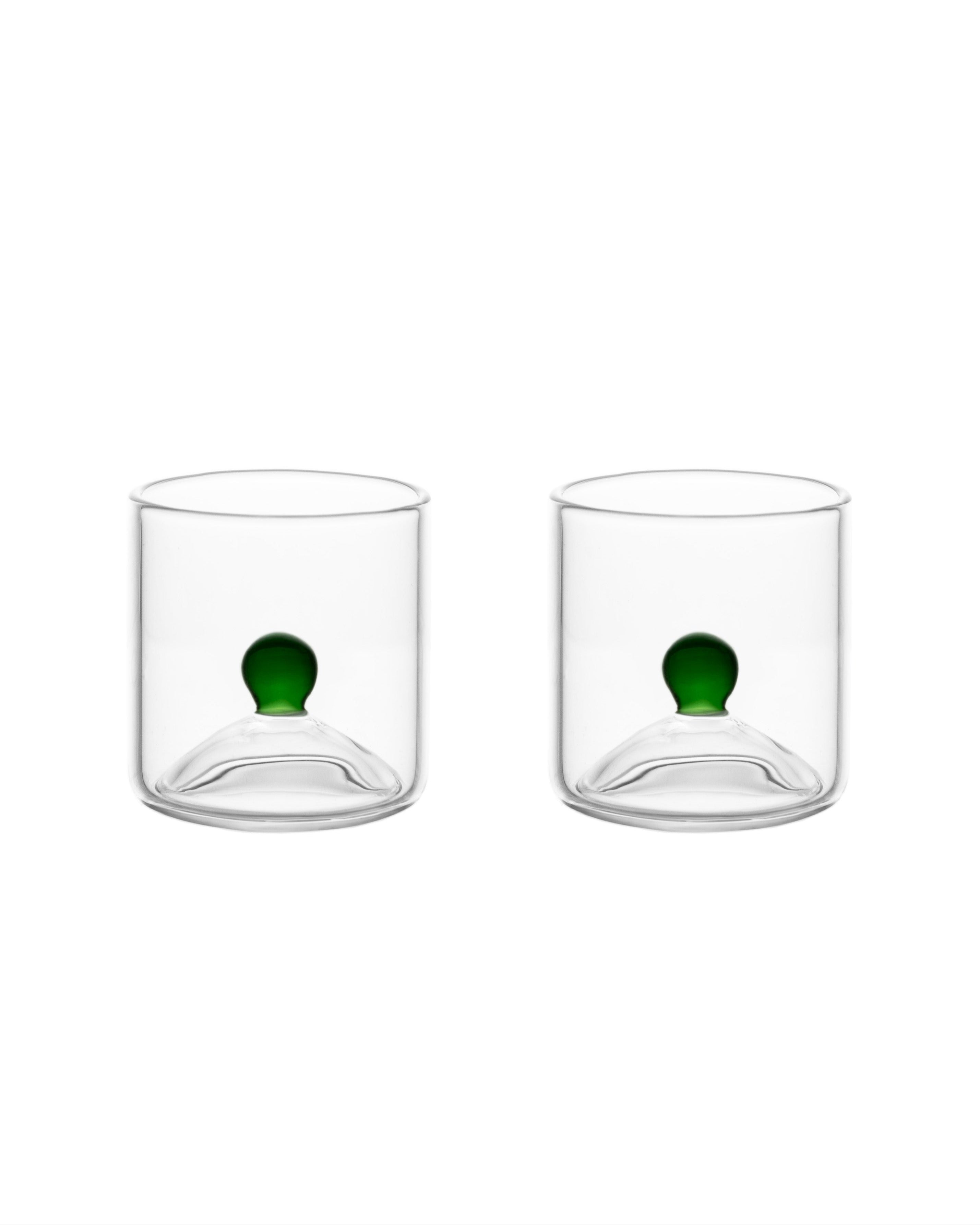 Two clear glass shot glasses with green sphere detail, Las Chicas duo