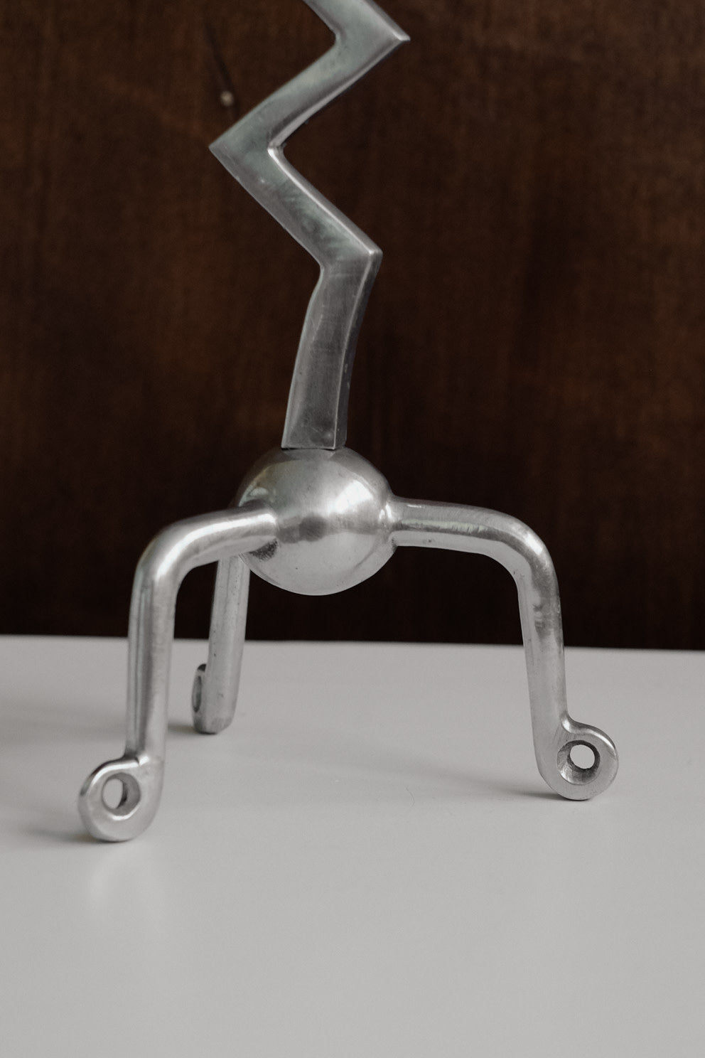 Zigzag Candleholder — side angle showing polished metal design