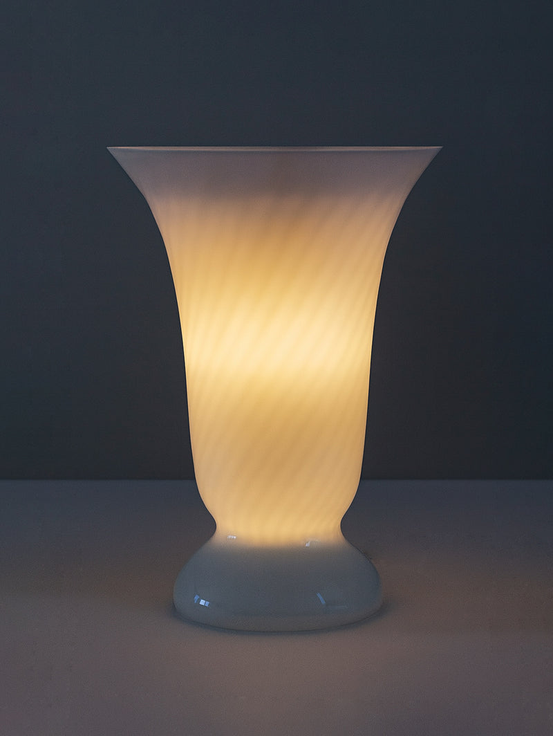 Illuminated Murano glass goblet table lamp with warm amber glow
