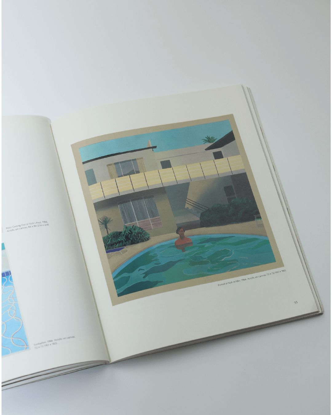 Pictures by David Hockney — open book on white surface showing pool scene
