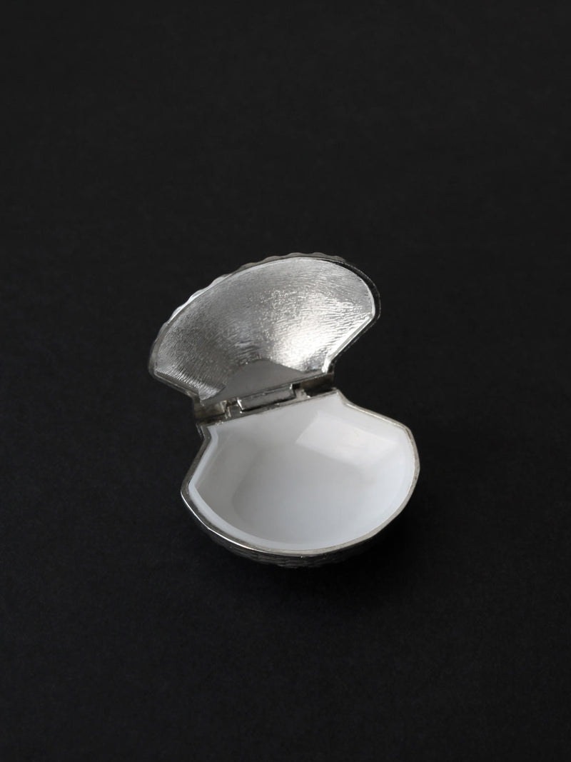 Open silver plated shell pill box showing white interior detail