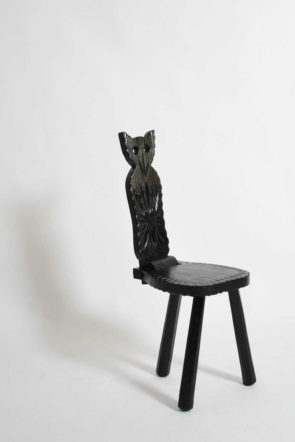 Pair of Brutalist Ebonised Wood Owl Chairs, 1960s — side angle highlighting carved owl backrest
