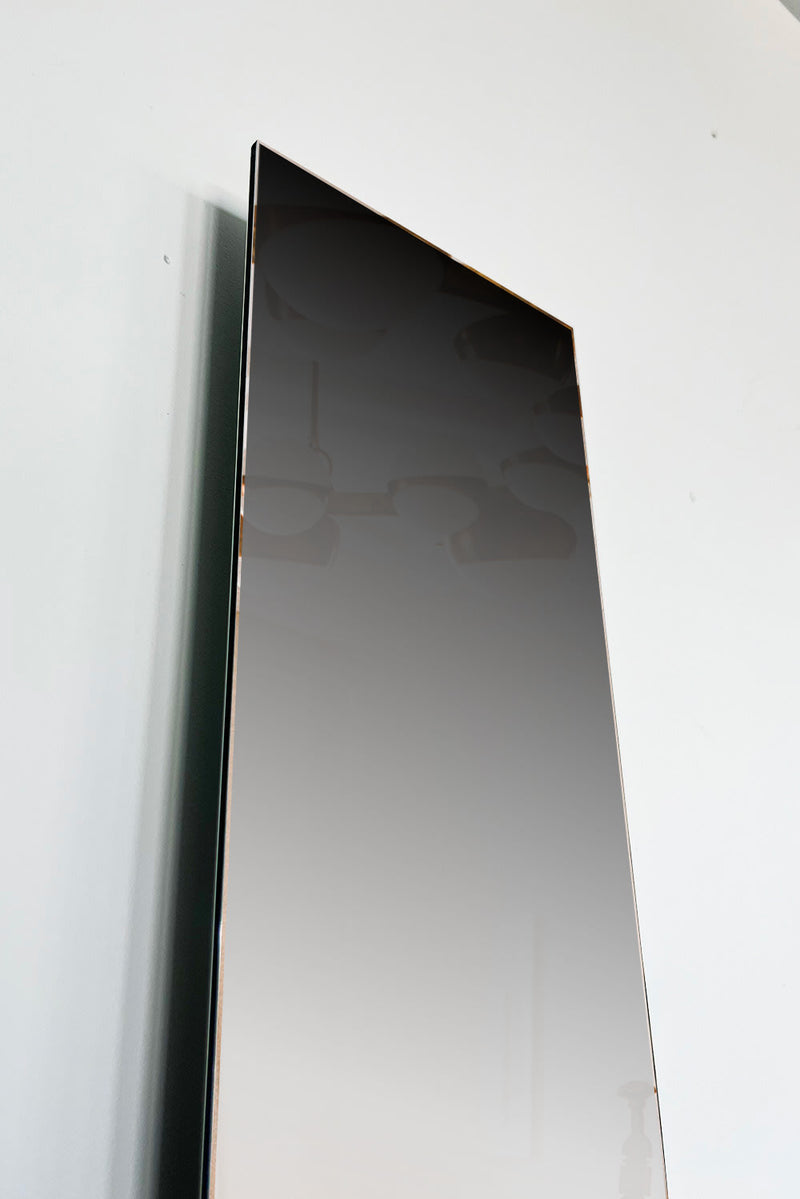 Mirrored Sculpture - Osmose 02 — close-up of reflective surface against white wall