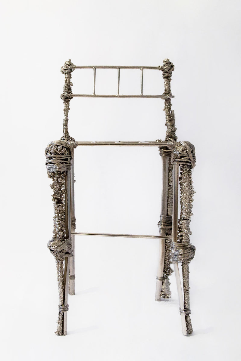 Fisherman Chair, Sculptural Chair — close-up of textured metal frame