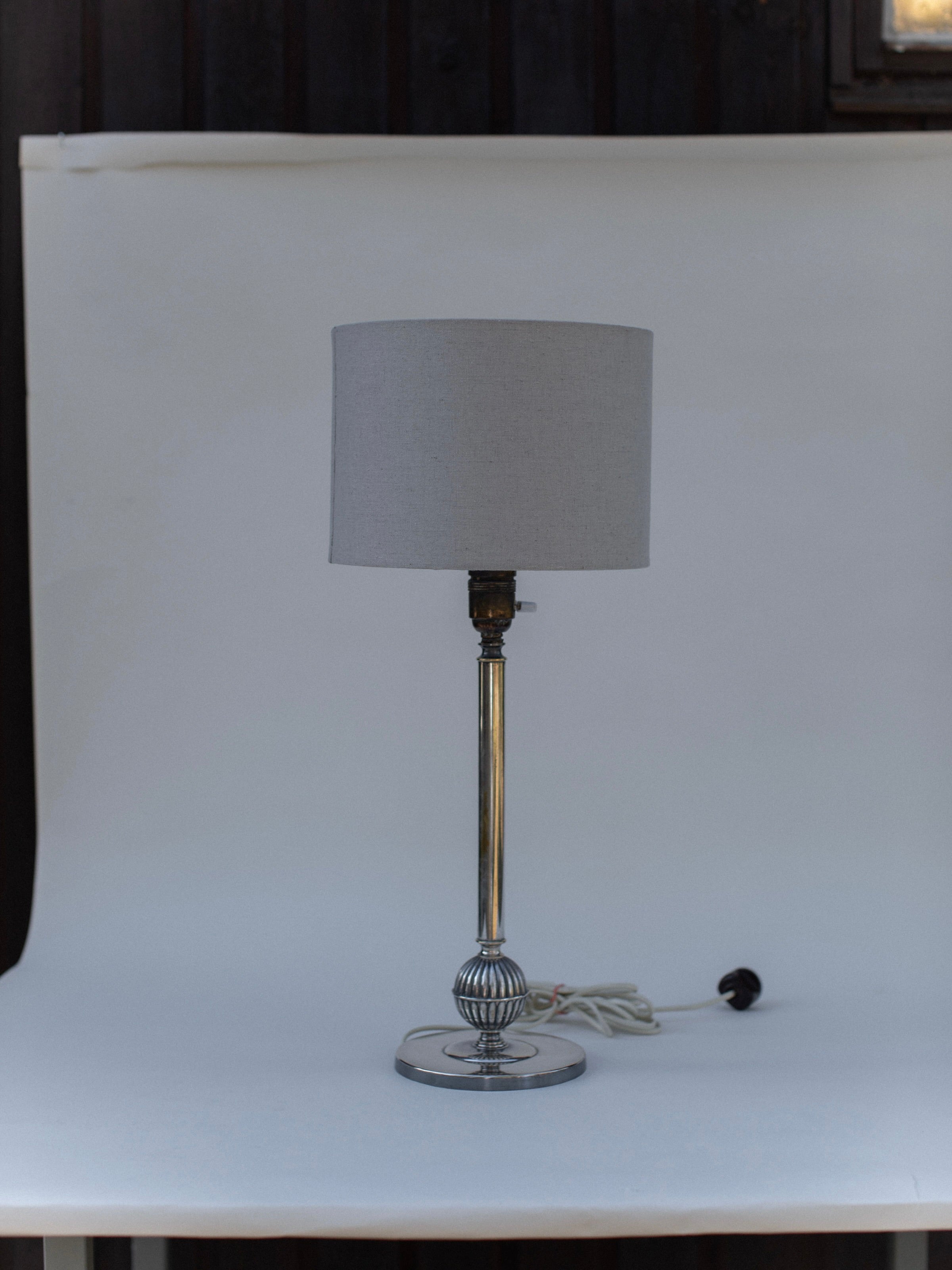 1920s Swedish Grace table lamp with chrome base and gray shade