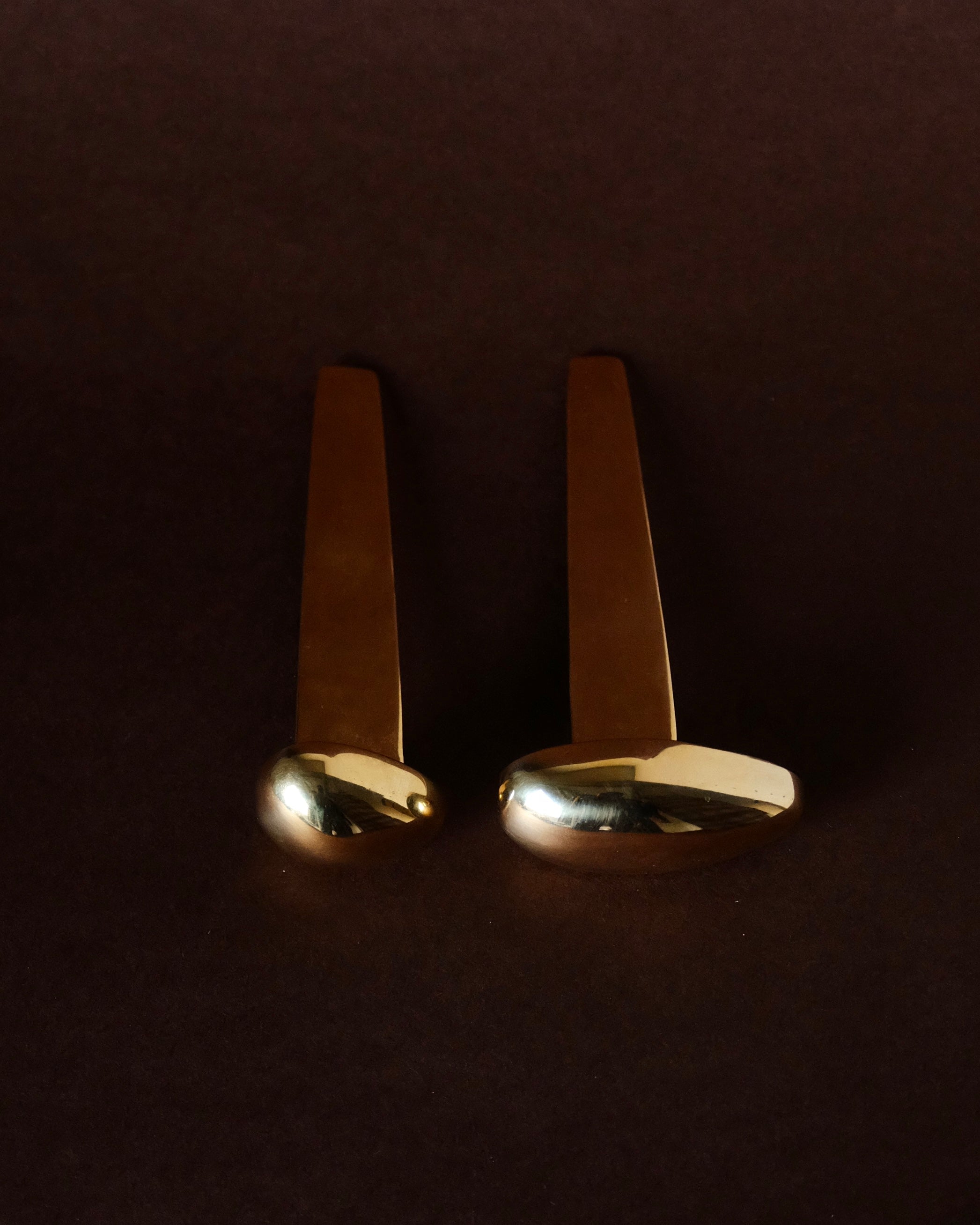MOMI Bookmark No. 2 — side angle of polished brass design