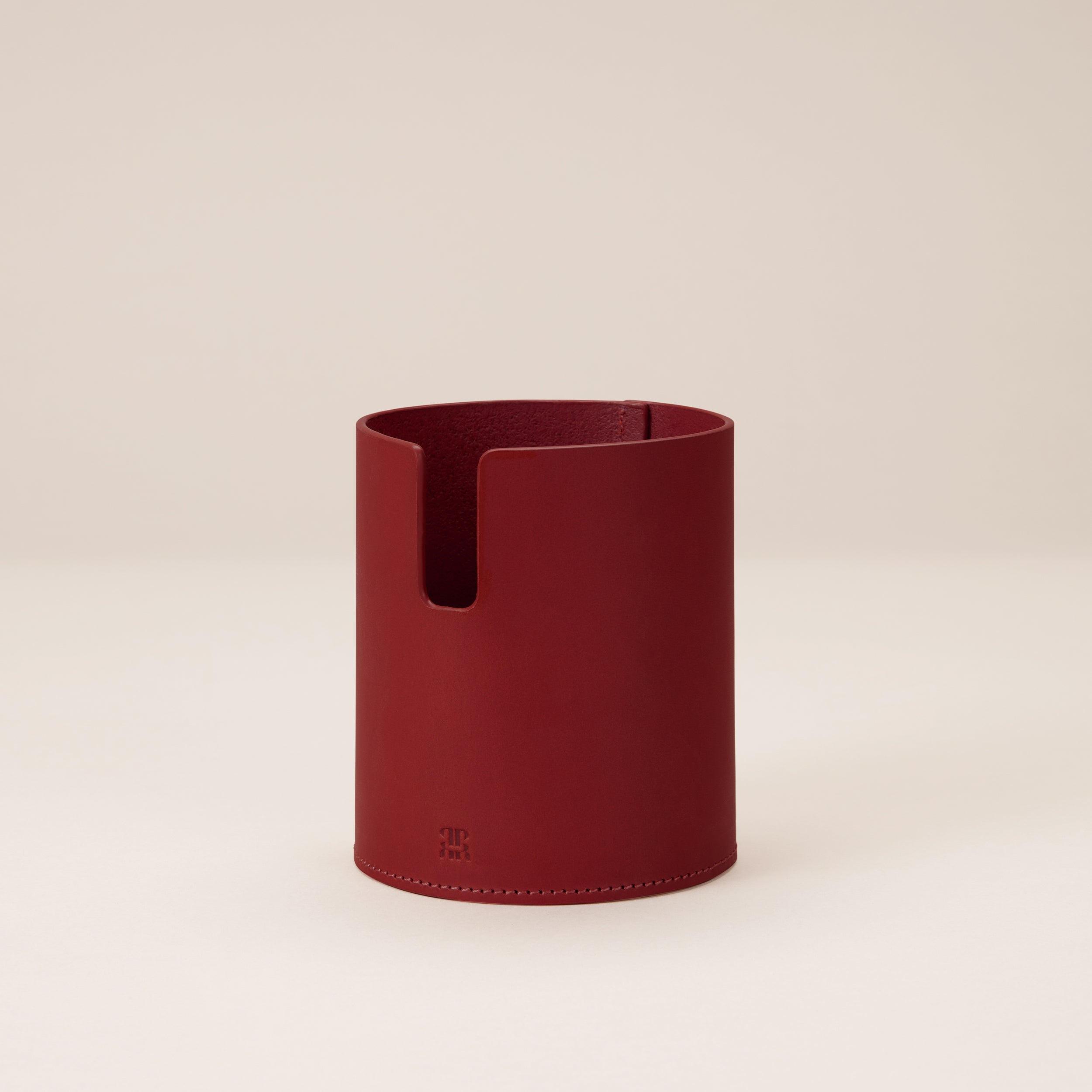 Leather Desk Gift Set — red leather pen holder on beige background