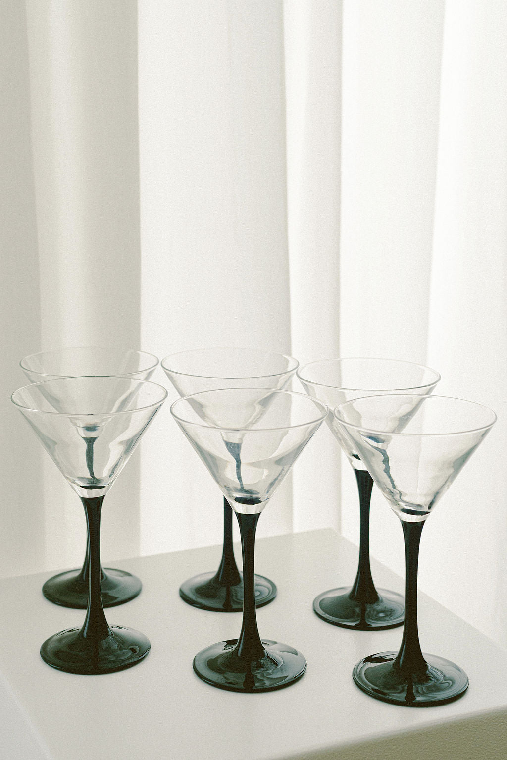 Luminarc Domino Martini Glasses — close-up of clear glass with black stems