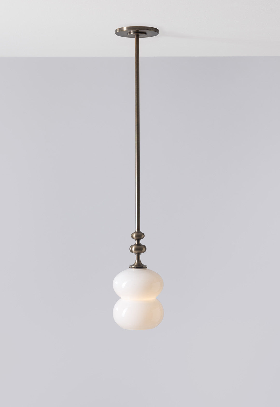 SkLO + AvroKO Oestre Pendant - Light Beige glass, Antique Brass finish — close-up