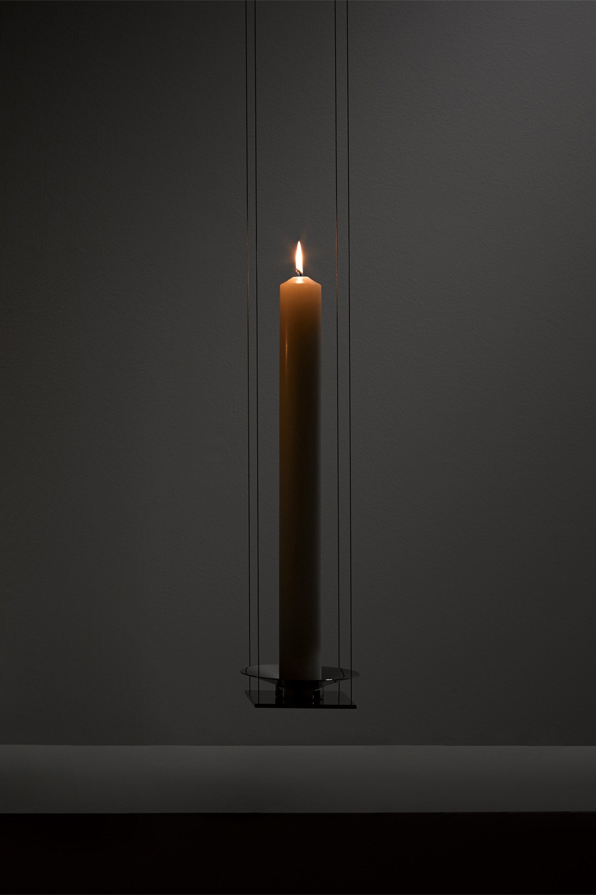 WAN PENDANT — side angle showing candle in minimalist setting