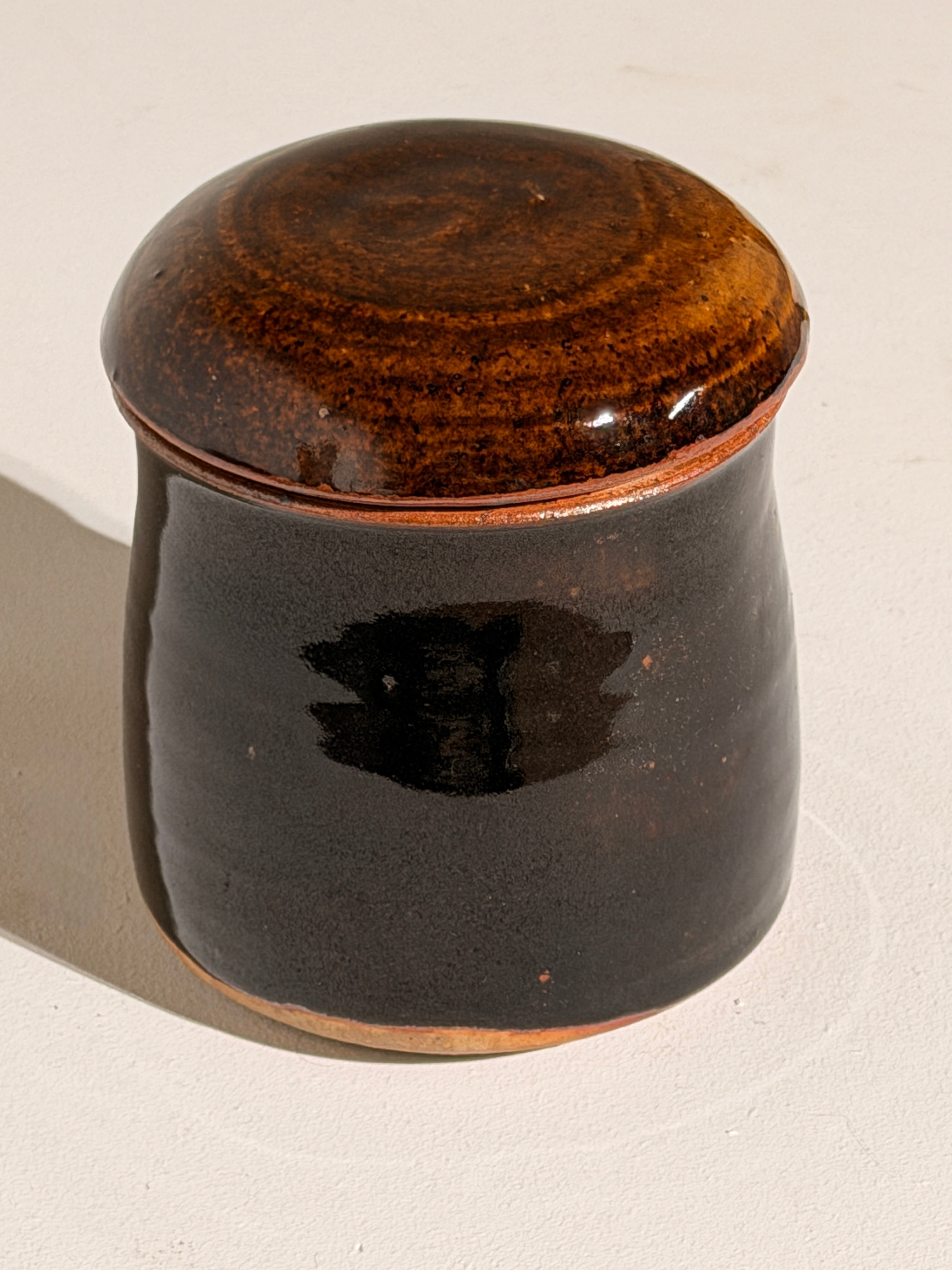 Lidded Stoneware Pot, France, circa 1960–1970 — close-up of dark glazed surface