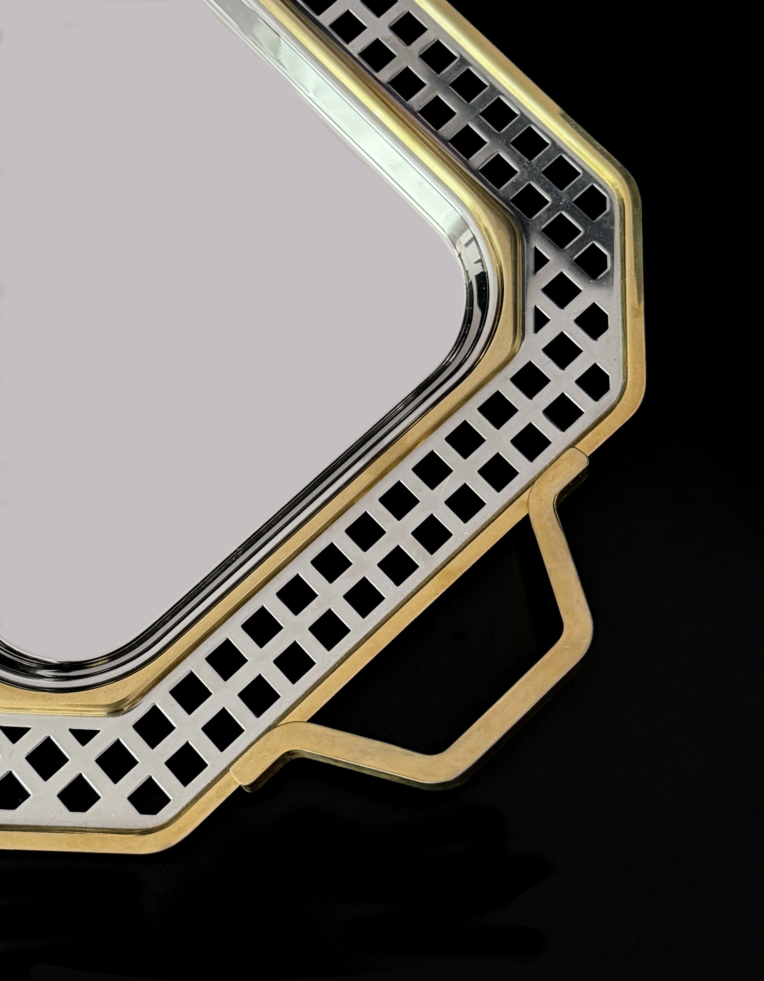 Vintage tray from 1970s Italy is a polished stainless steel — detail view