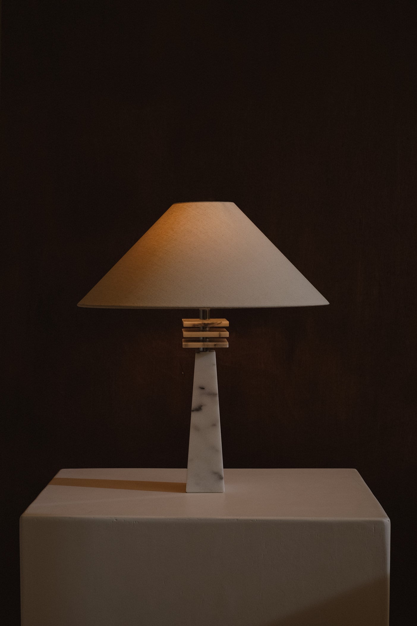 Marble Table Lamp — back view with warm light on fabric shade