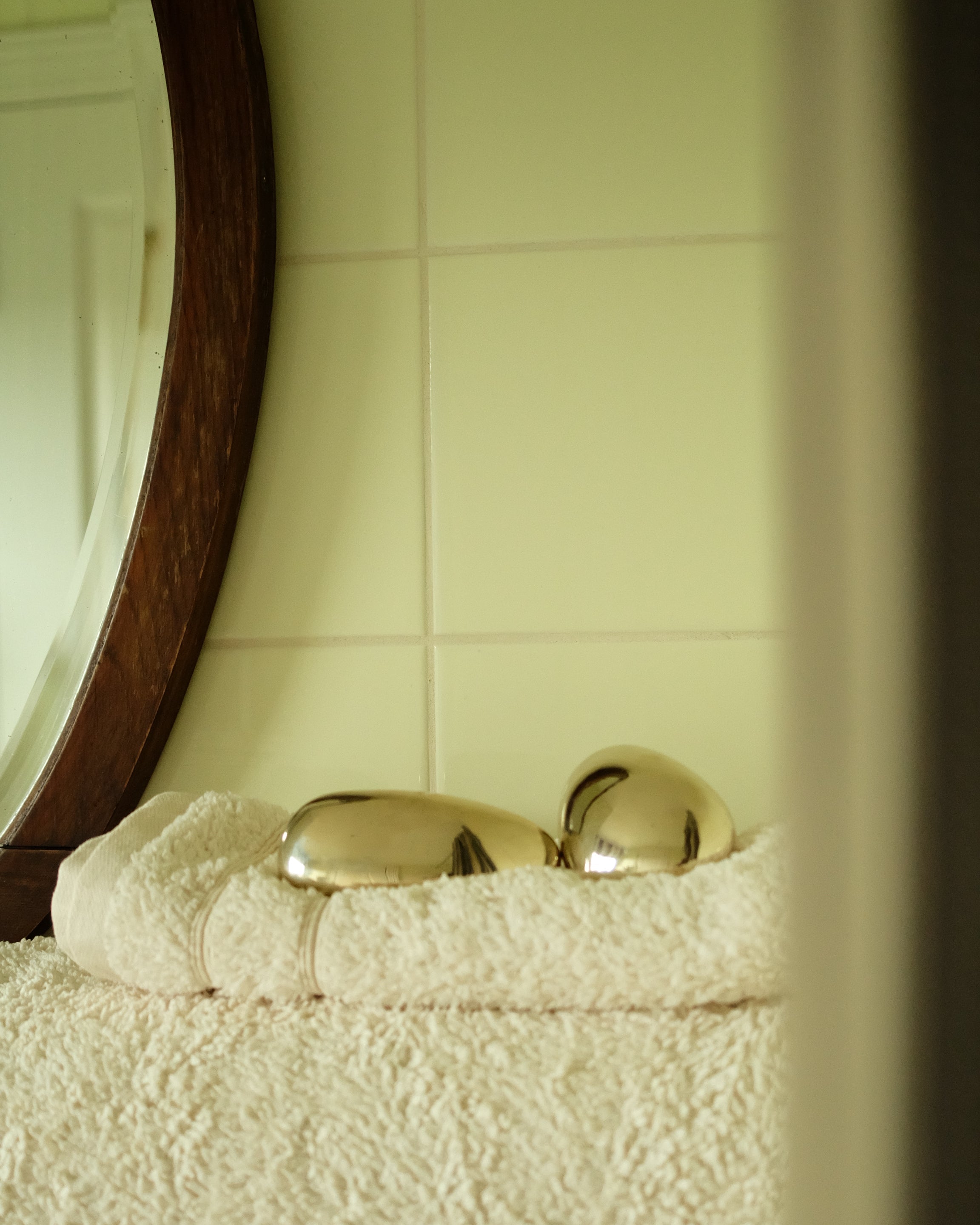 MOMI Cabinet Knob/Wall Hook Short — side view on towel in bathroom