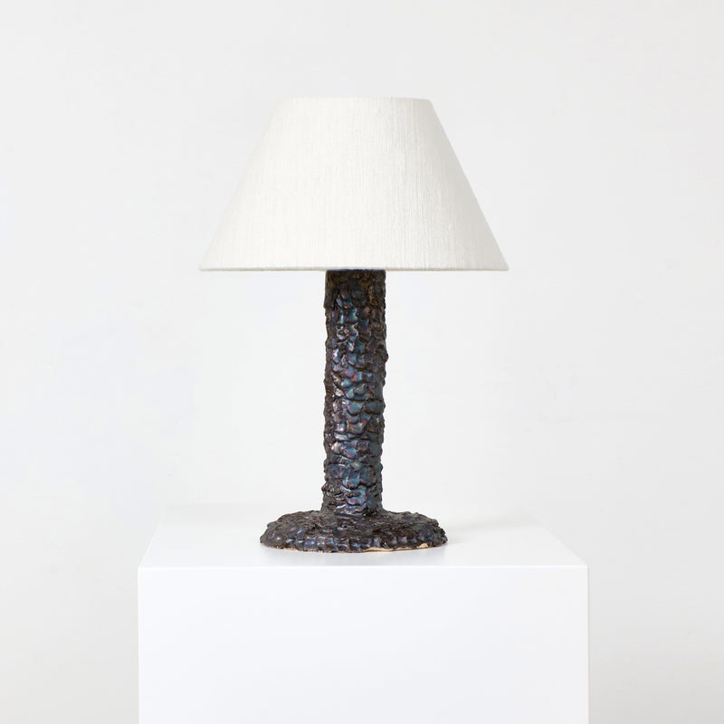 Casa Bedside Light — close-up of textured bronze base and fabric shade