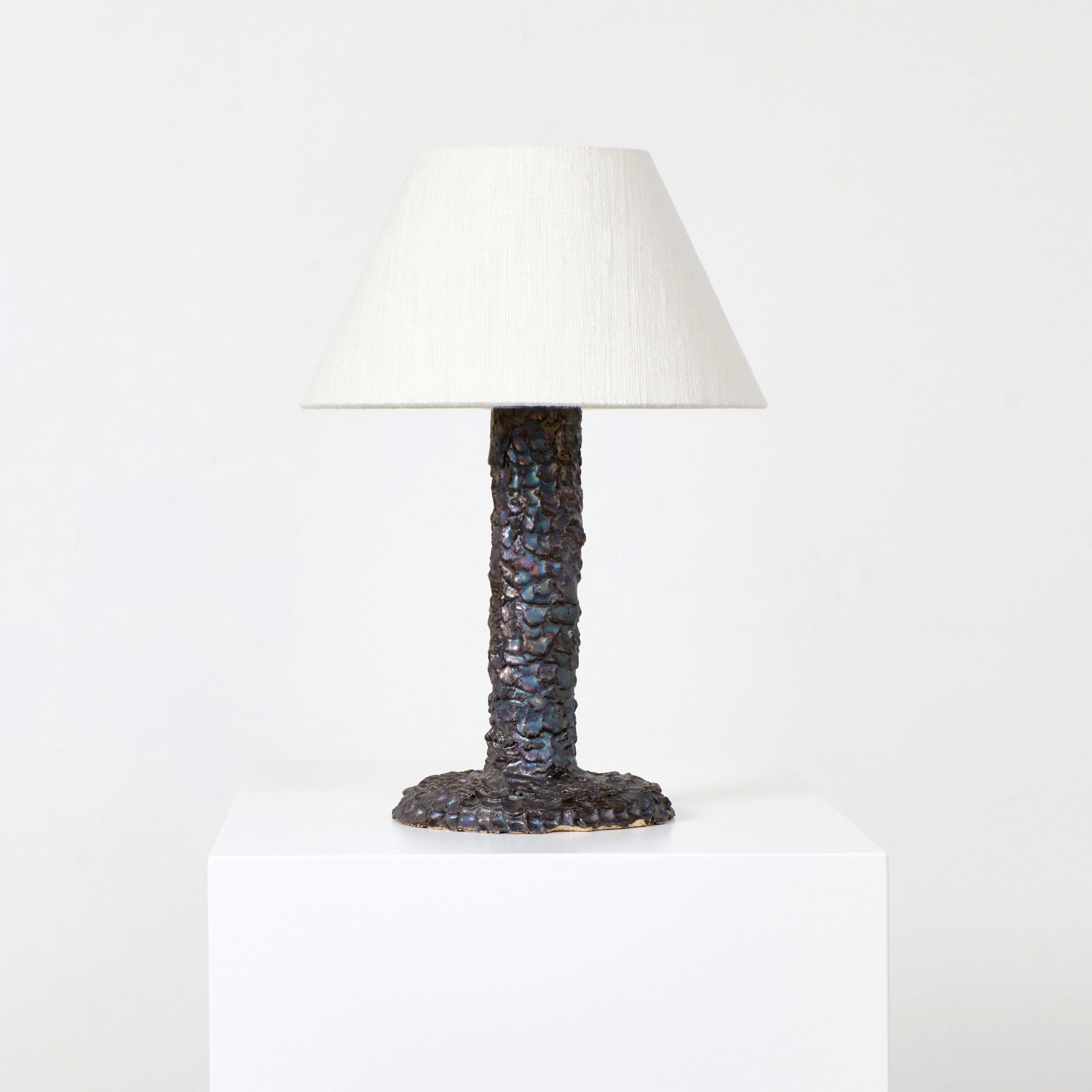 Casa Bedside Light — close-up of textured bronze base and fabric shade