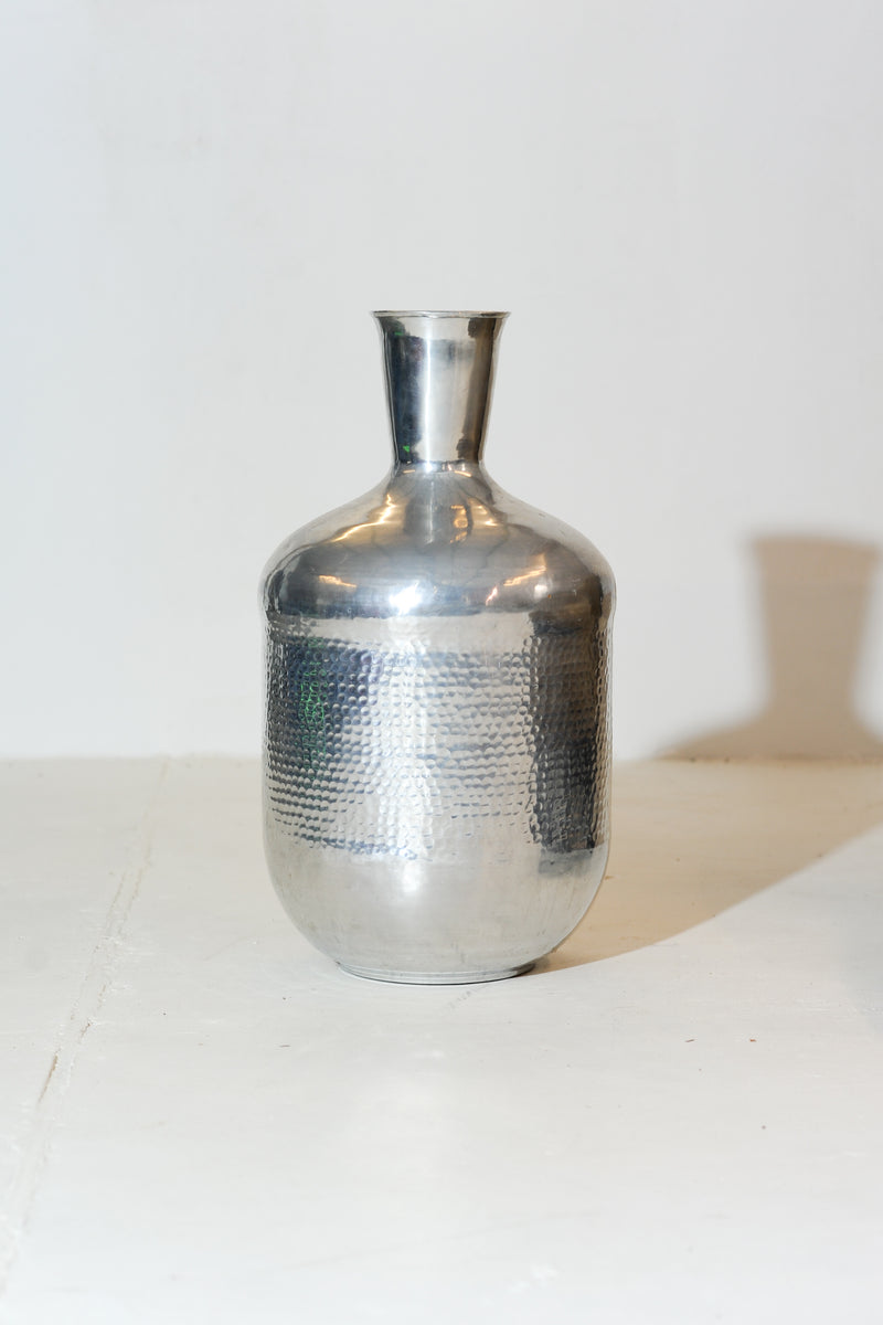 Hammered aluminum bottle vase with narrow neck from India