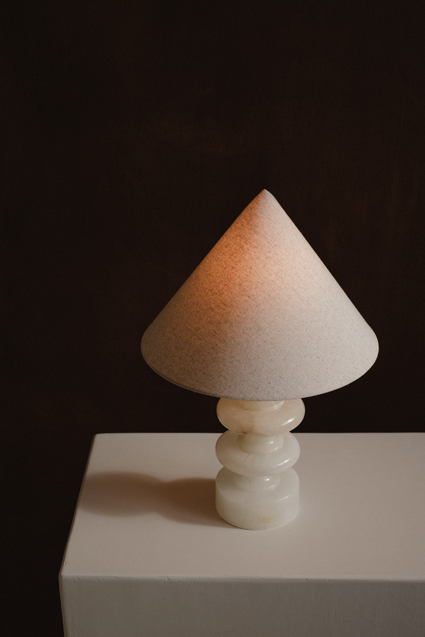 Sculptural Alabaster Table Lamp — angled view highlighting soft beige shade