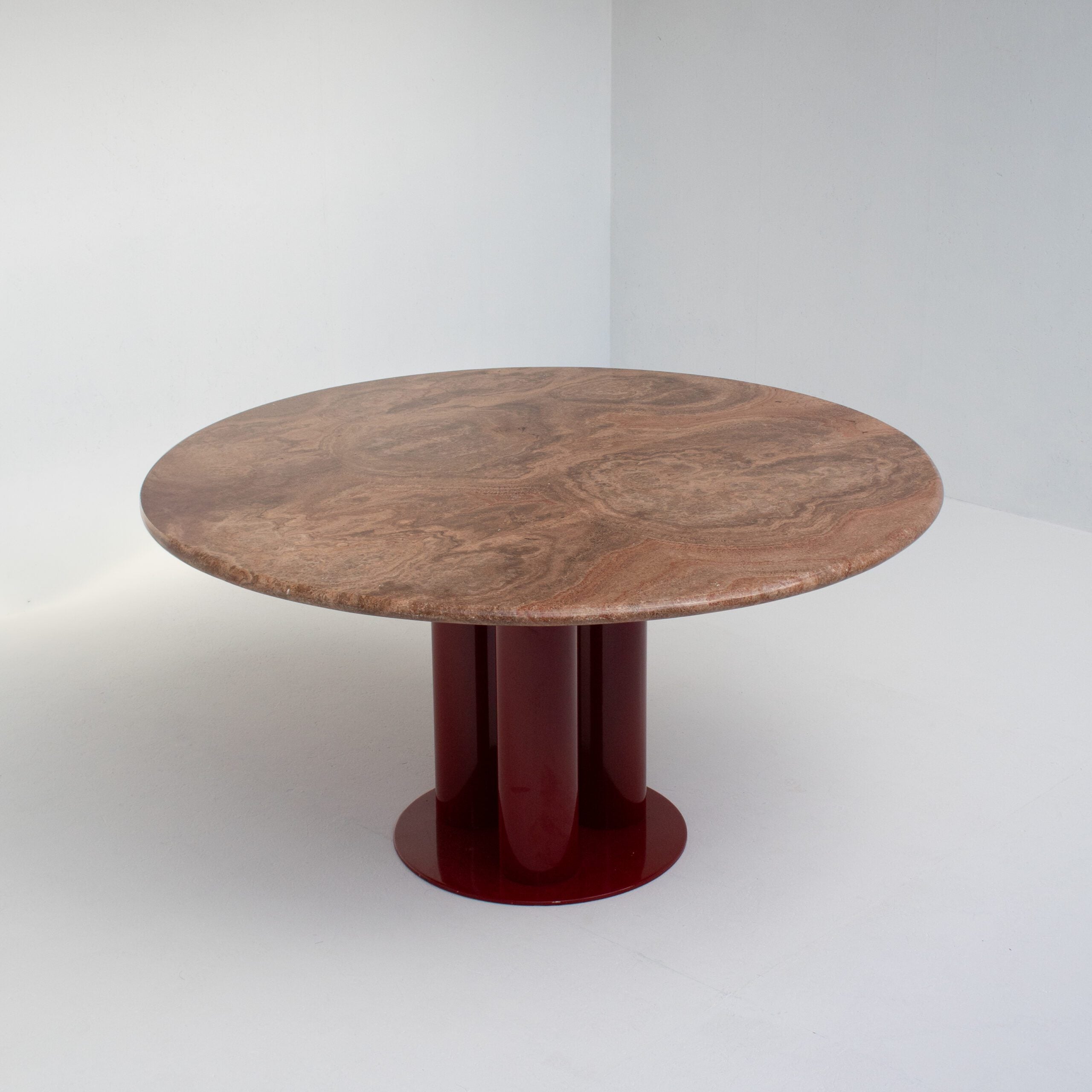 Round Marble Dining Table with Burgundy Lacquered Base — side angle showing round marble top and lacquered base