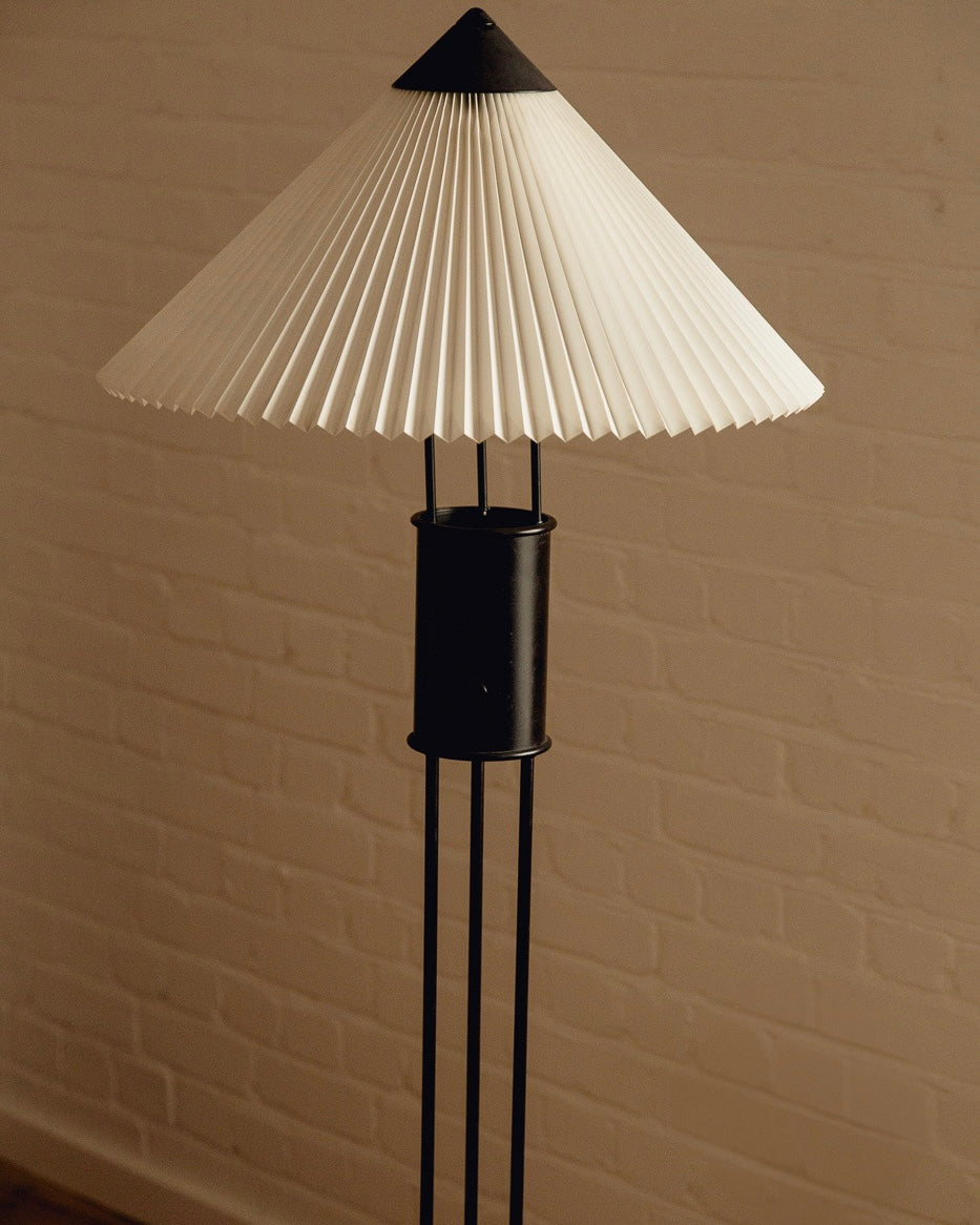 Le Klint Floor Lamp — top view of pleated white shade and black base