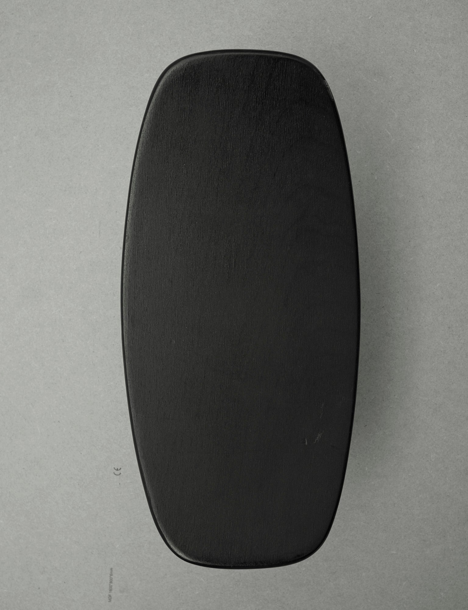Alain Gaubert meditation stool in black solid beech, France c. 1980 — lifestyle setting