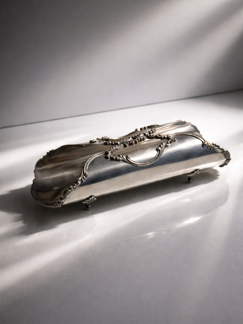 Italian Breadstick Holder - 1950s — close-up of silver surface with ornate details