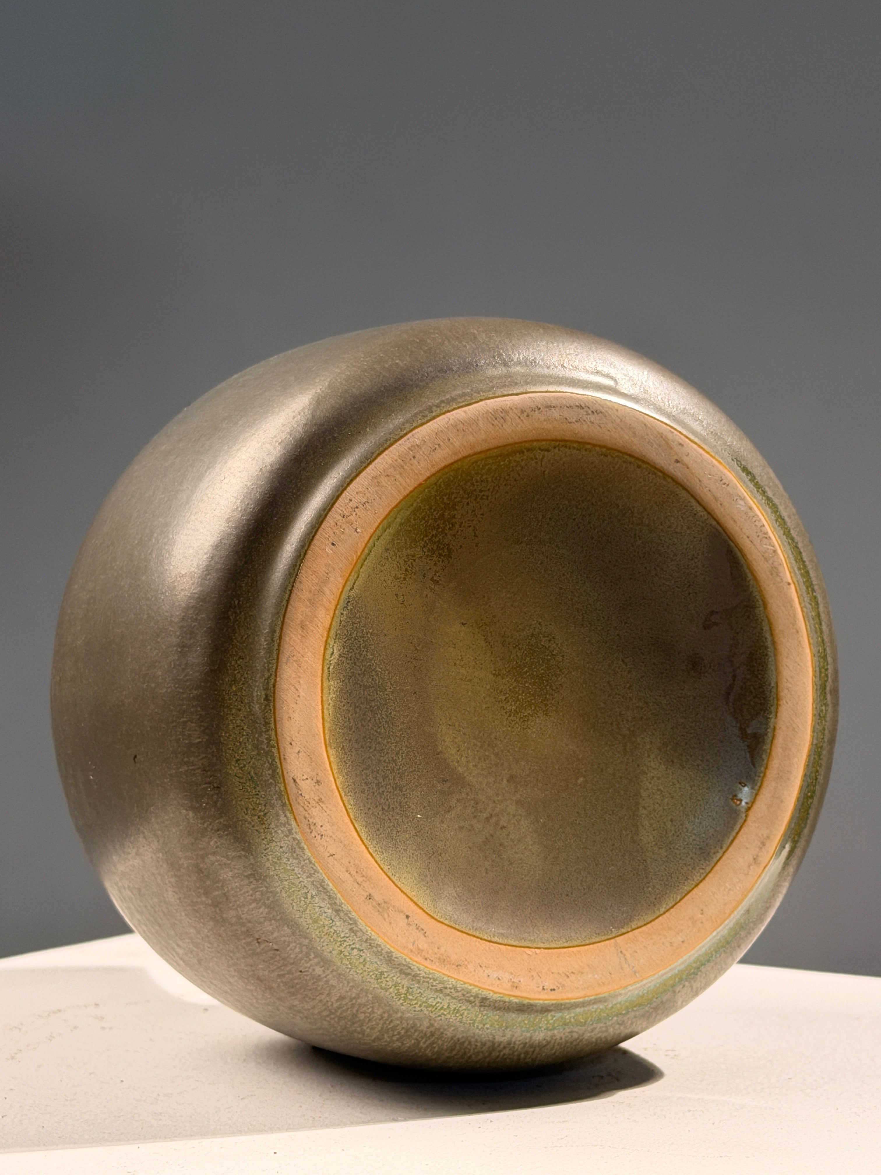 Speckled green glazed earthenware bottle vase, circa 1970 — lifestyle setting