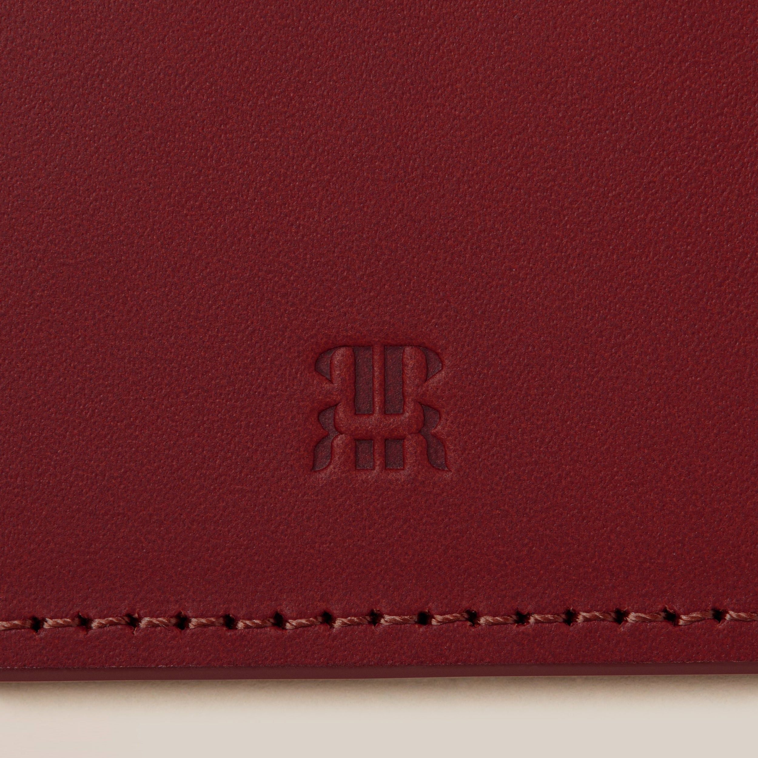 Leather Passport Holder — close-up of rich red leather texture