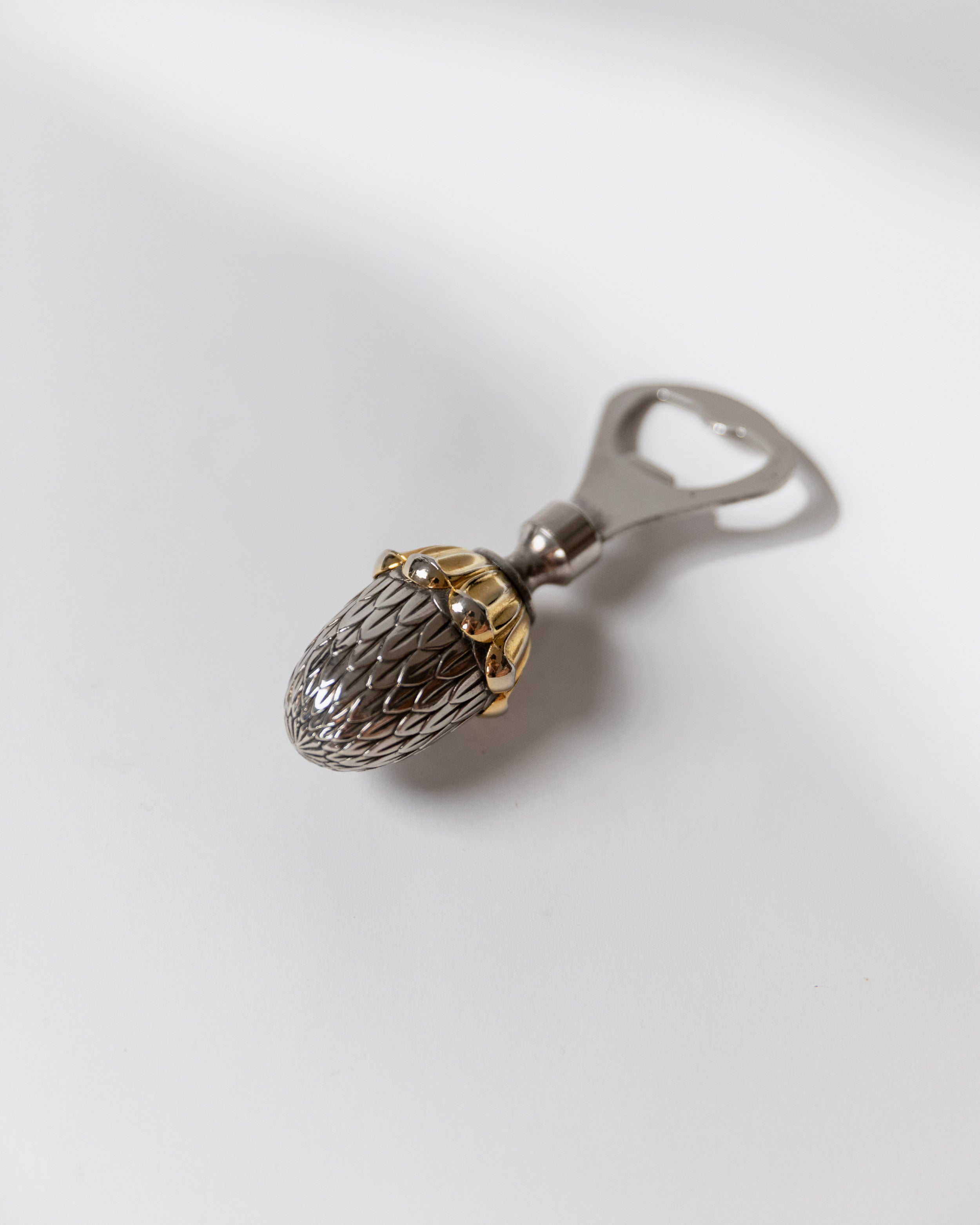 Silver-plated bottle opener with textured oval detail, Italian 80s design