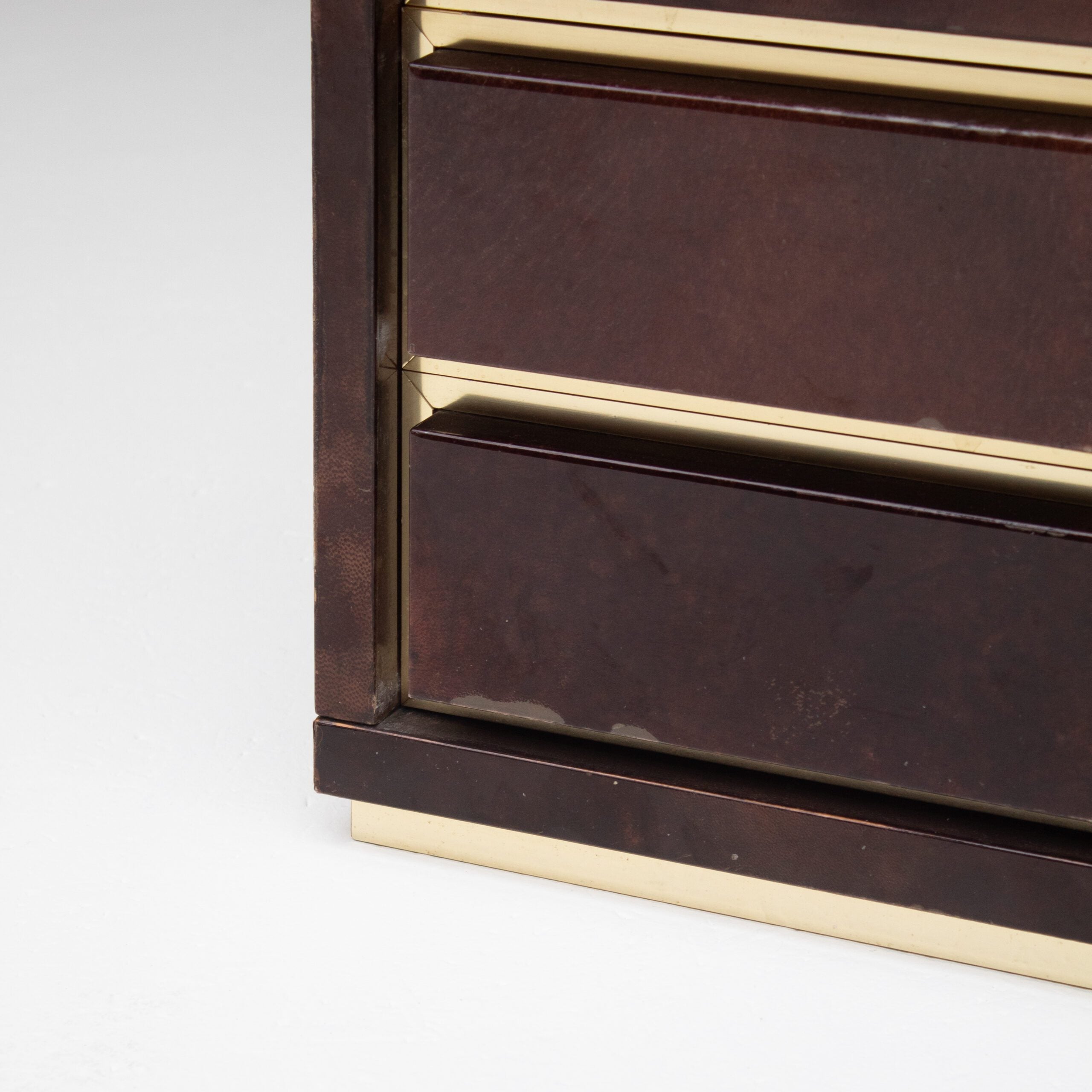 Pair of Aldo Tura (attr) Nightstands in Parchment and Brass — close-up of brass trim and drawer detail