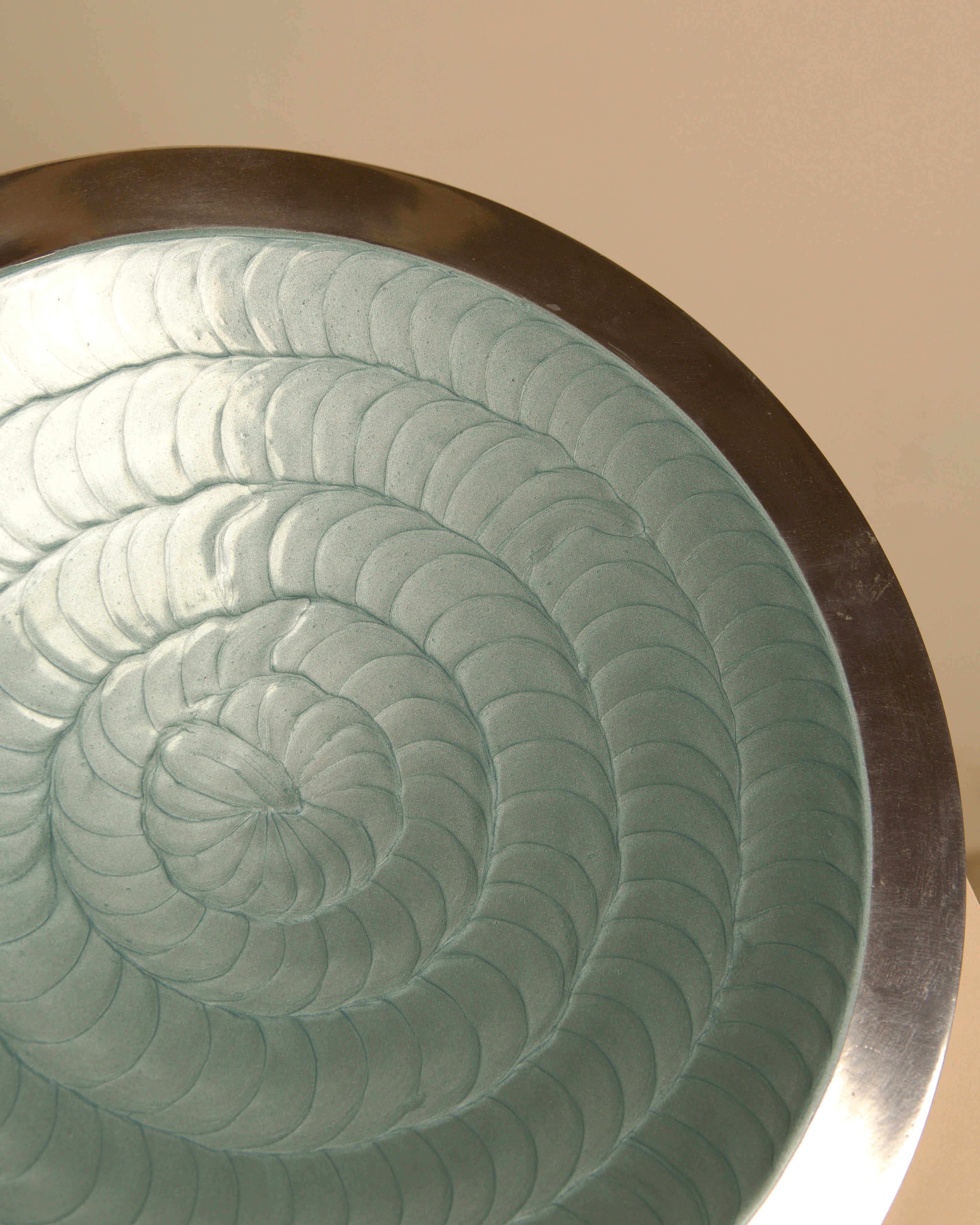 "Galassia" round aluminum dish, Brandani, Italy, 1980s — lifestyle setting