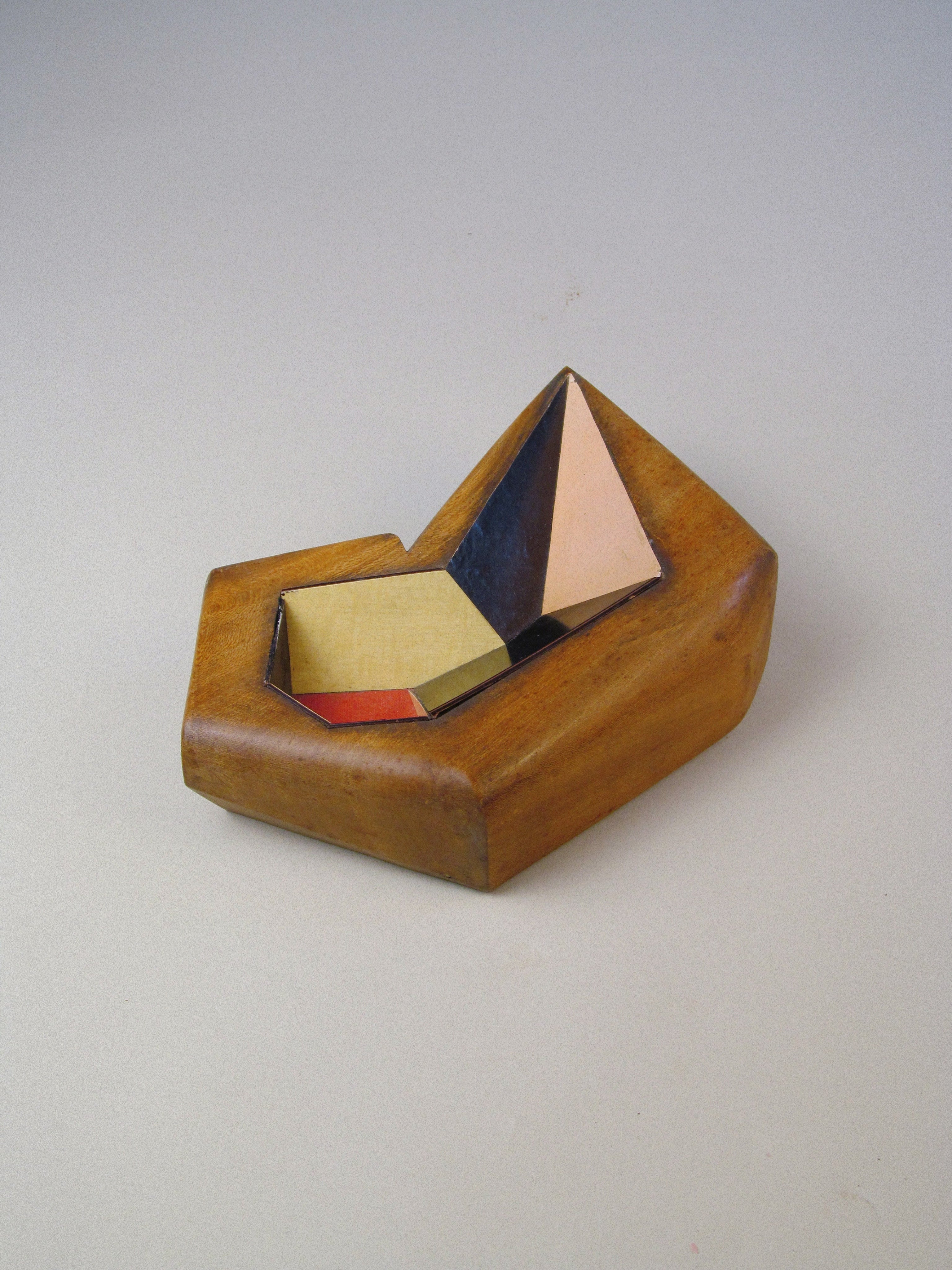 Cubist Vide Poche — angled view of wooden base with geometric shapes