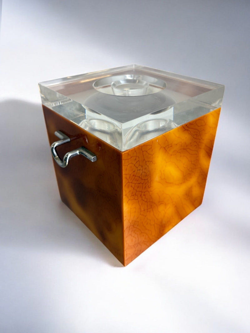 Faux Tortoise Shell Ice Bucket with tongs, Italy, 1970s — close-up of amber-colored surface with clear lid