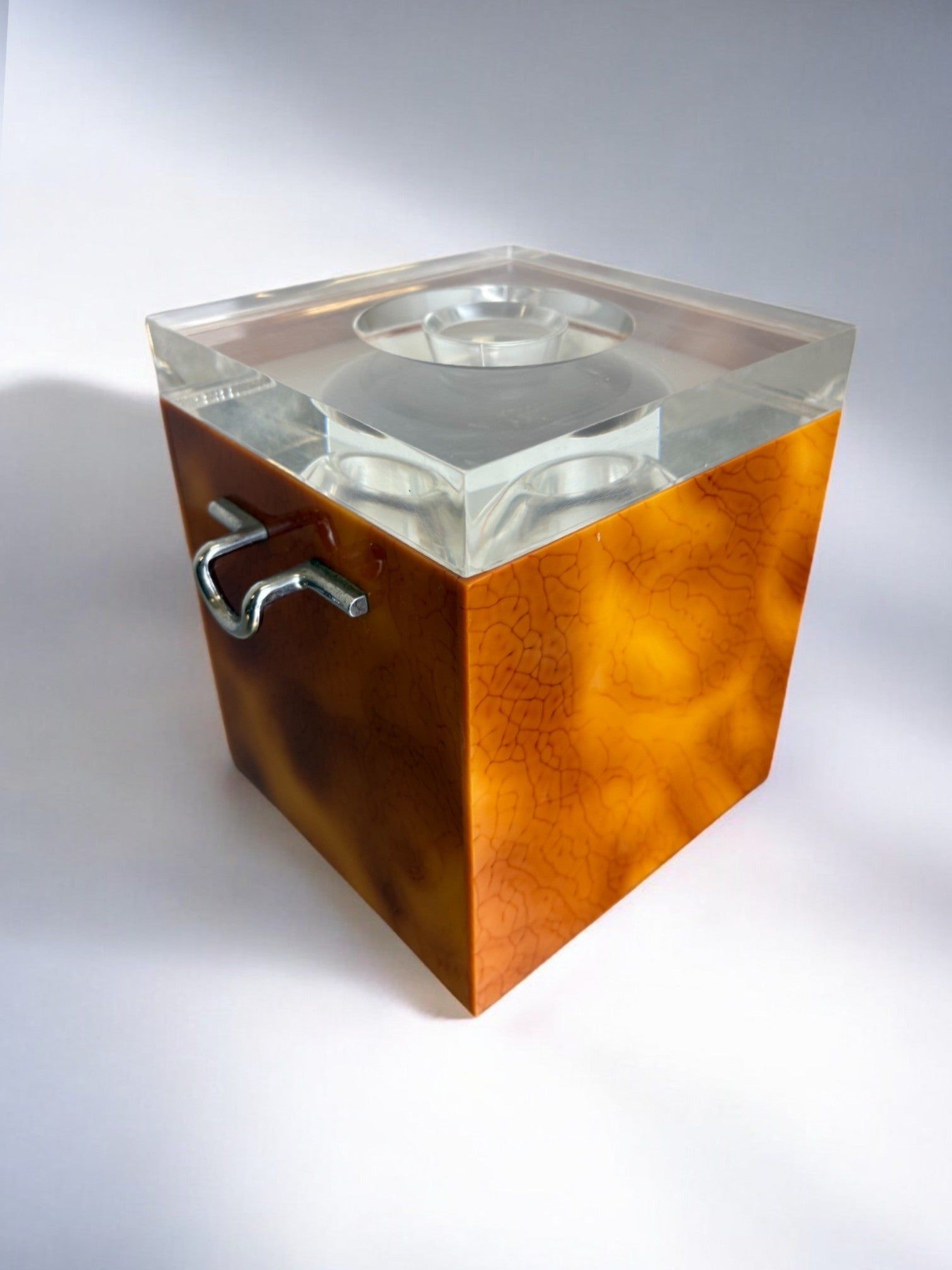 Faux Tortoise Shell Ice Bucket with tongs, Italy, 1970s — close-up of amber-colored surface with clear lid